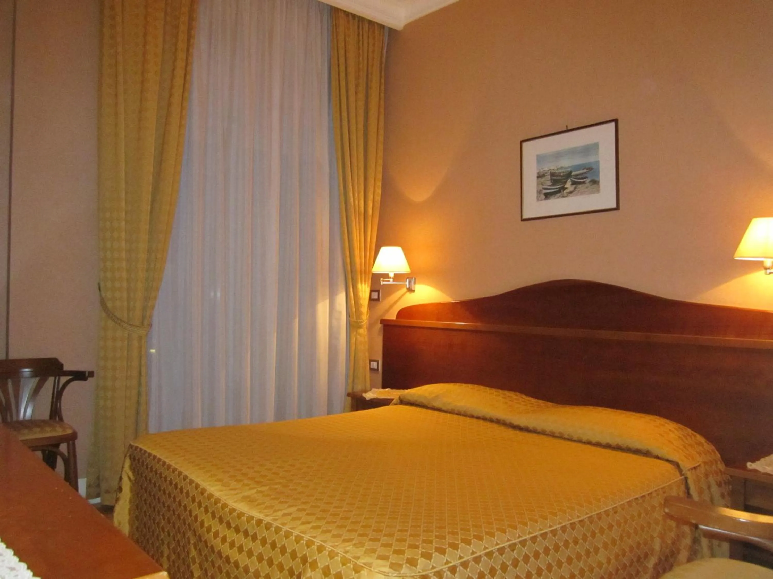 Bed in Hotel Conchiglia d'Oro