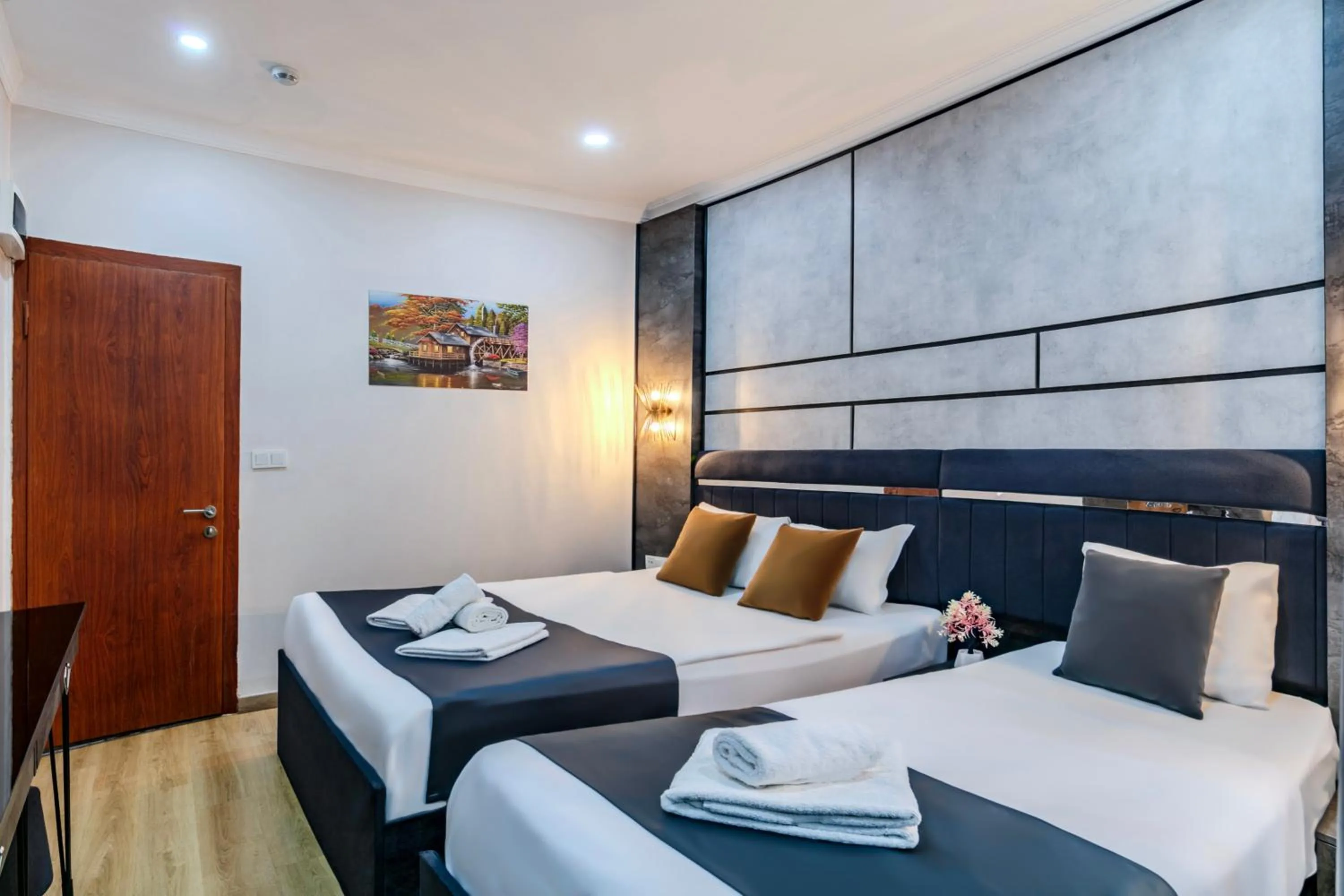 Bed in La Pazza Suites