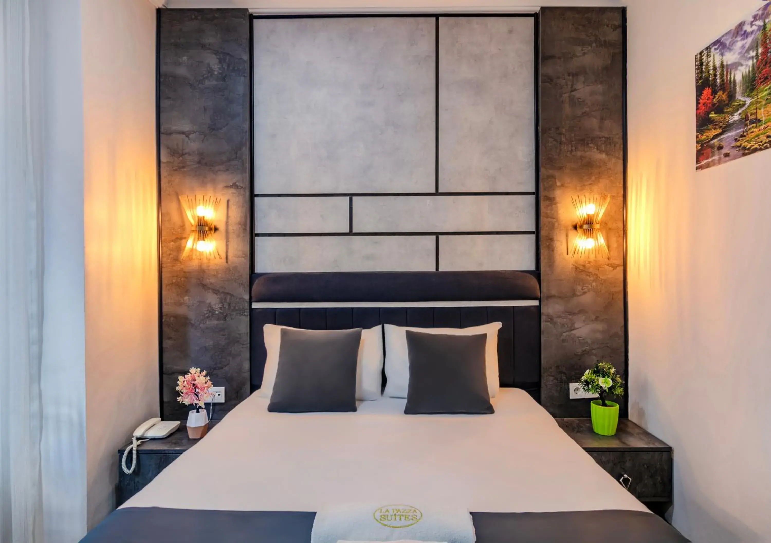 Bed in La Pazza Suites Bed in La Pazza Suites