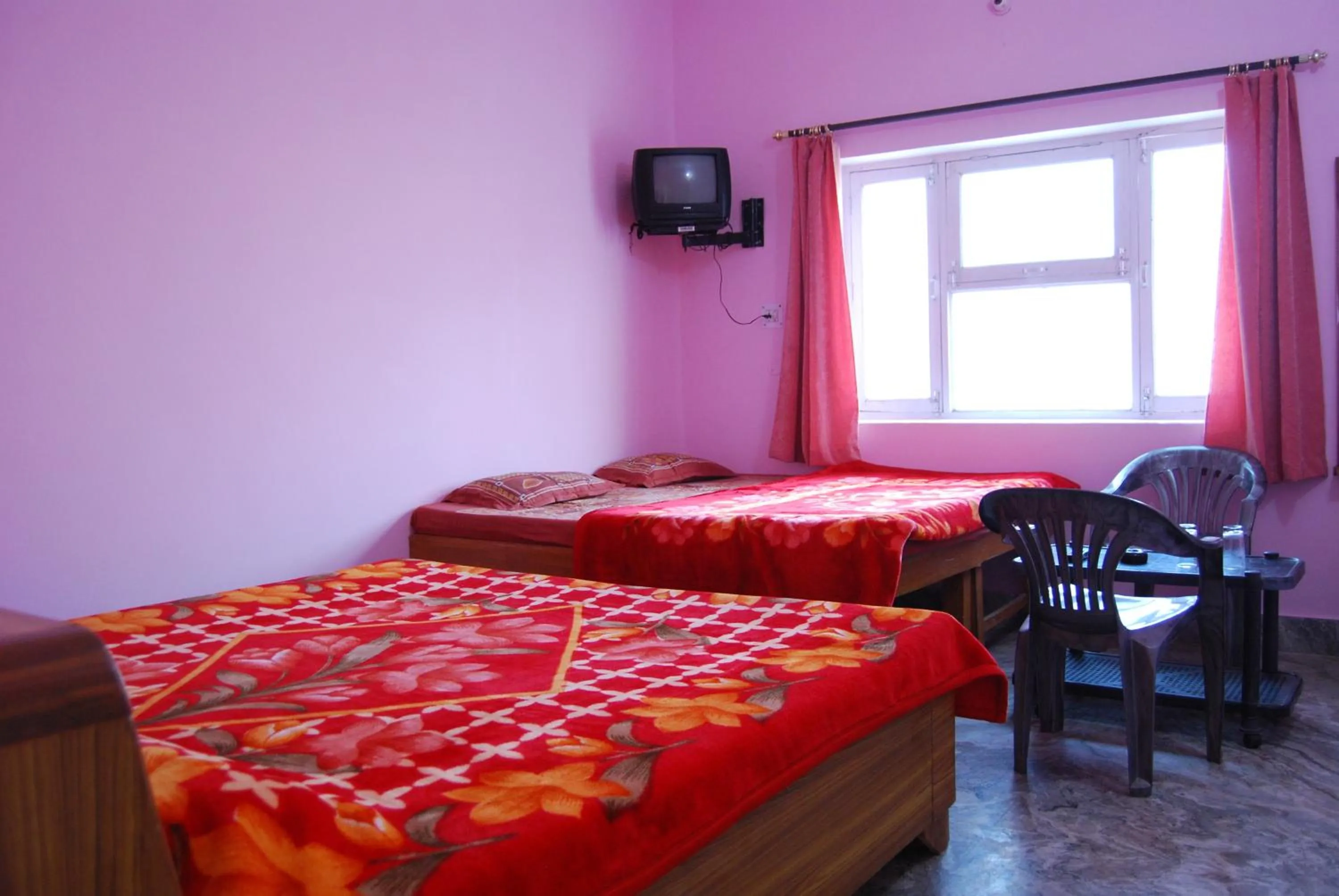 Bed in Hotel Shiv Ganga