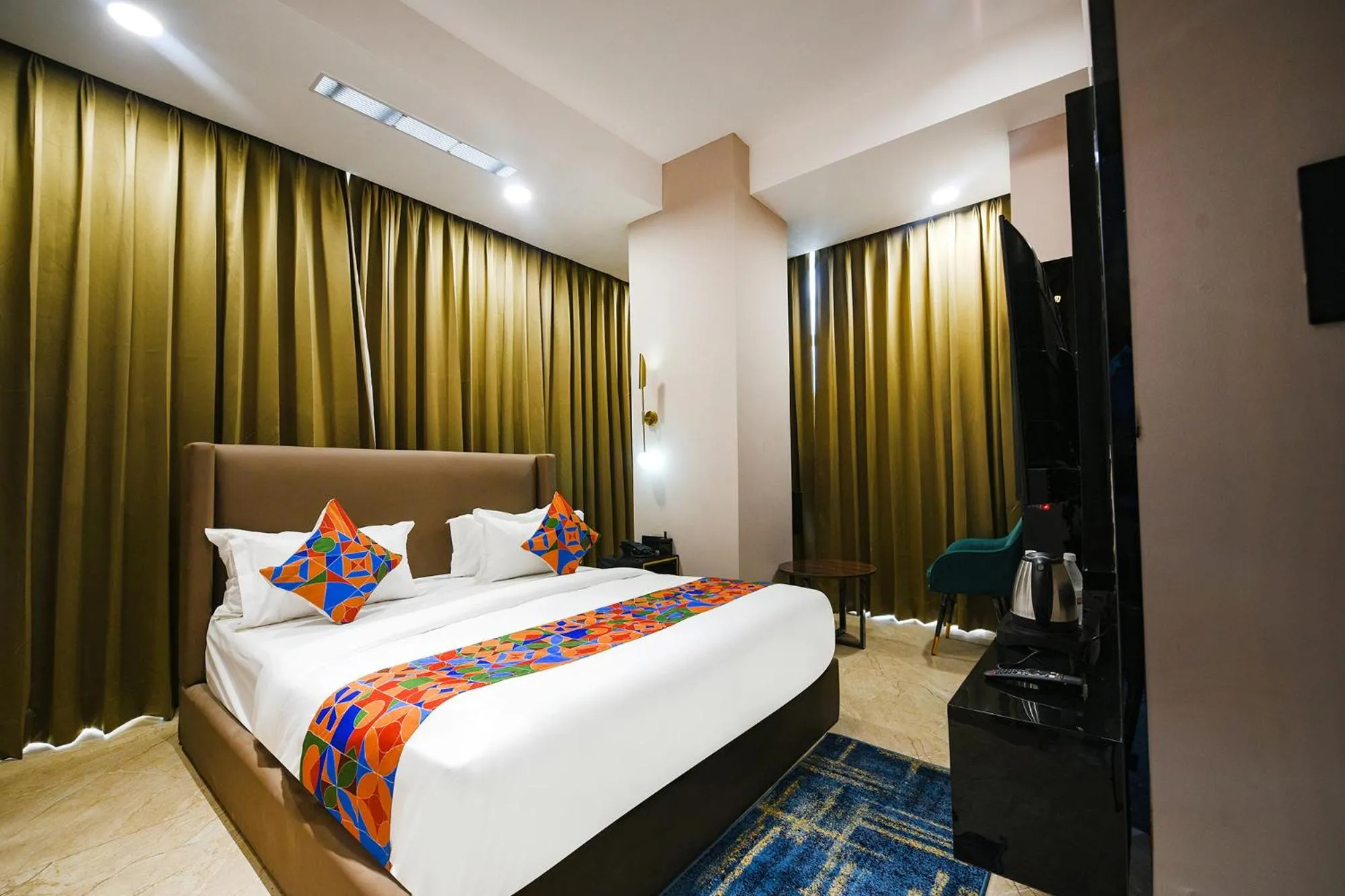 Bed in FabHotel Prime Elegance Suites