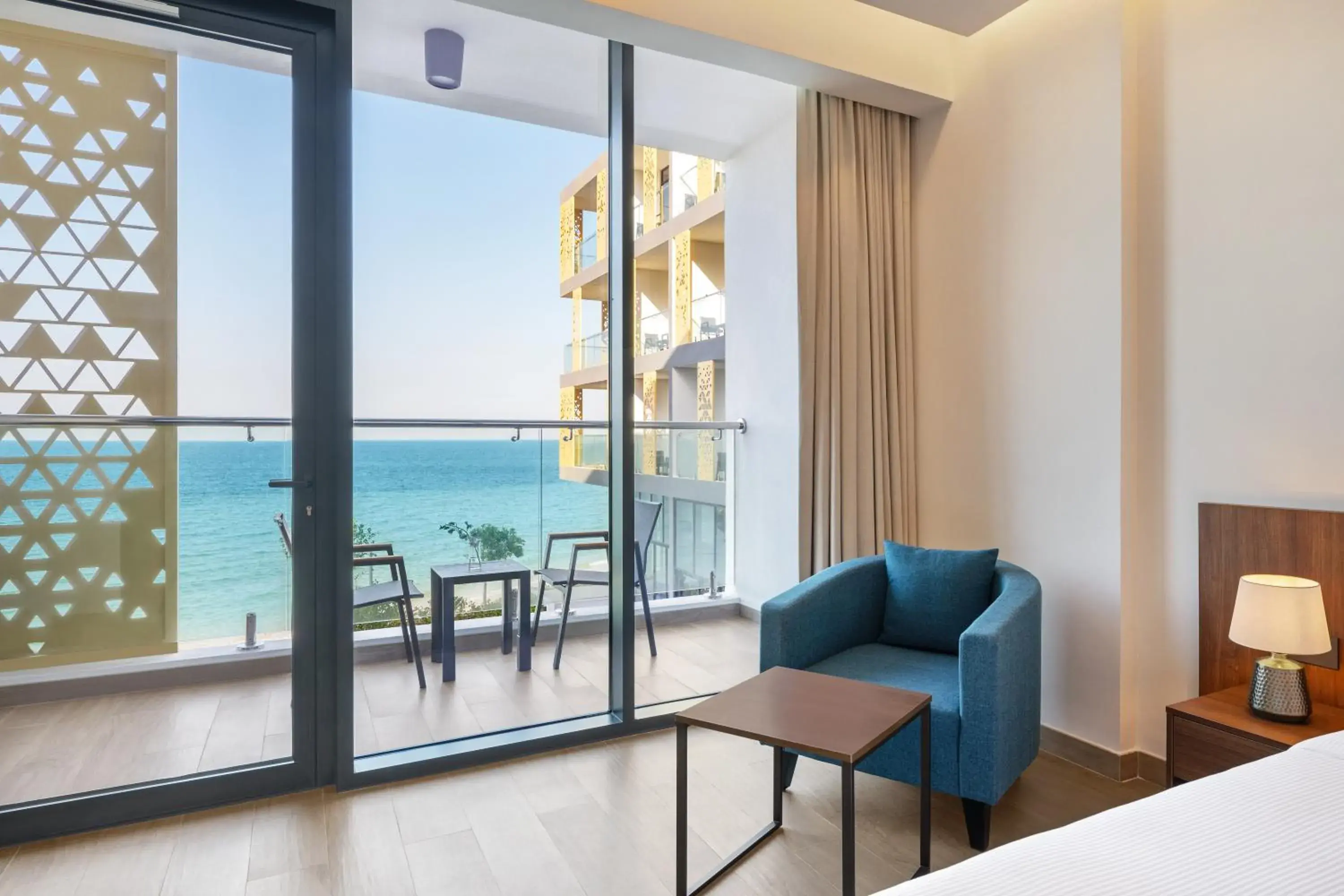 Balcony/Terrace, Bed in Beach Bay Hotel Mirfa Balcony/Terrace, Bed in Beach Bay Hotel Mirfa