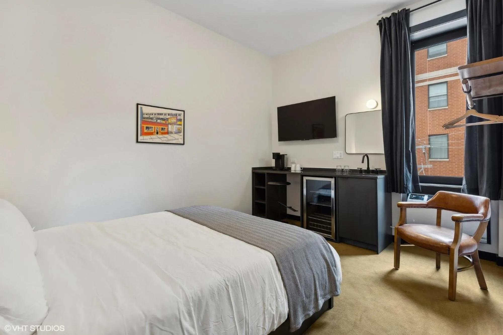 Bed in Logan Square SRO Hotel