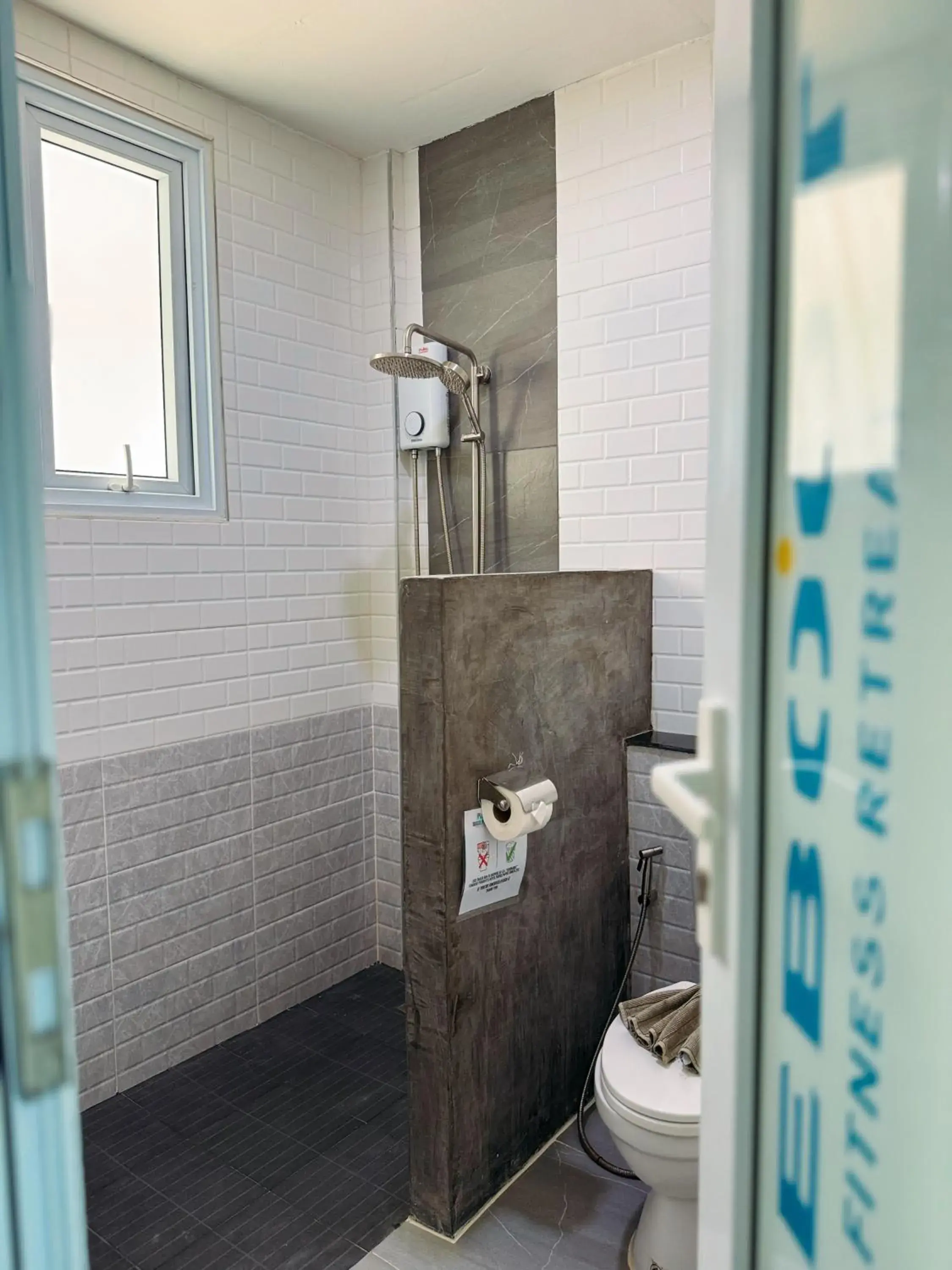 Bathroom in Reboot Beach Resort, Restaurant, and Coffee Shop Bathroom in Reboot Beach Resort, Restaurant, and Coffee Shop