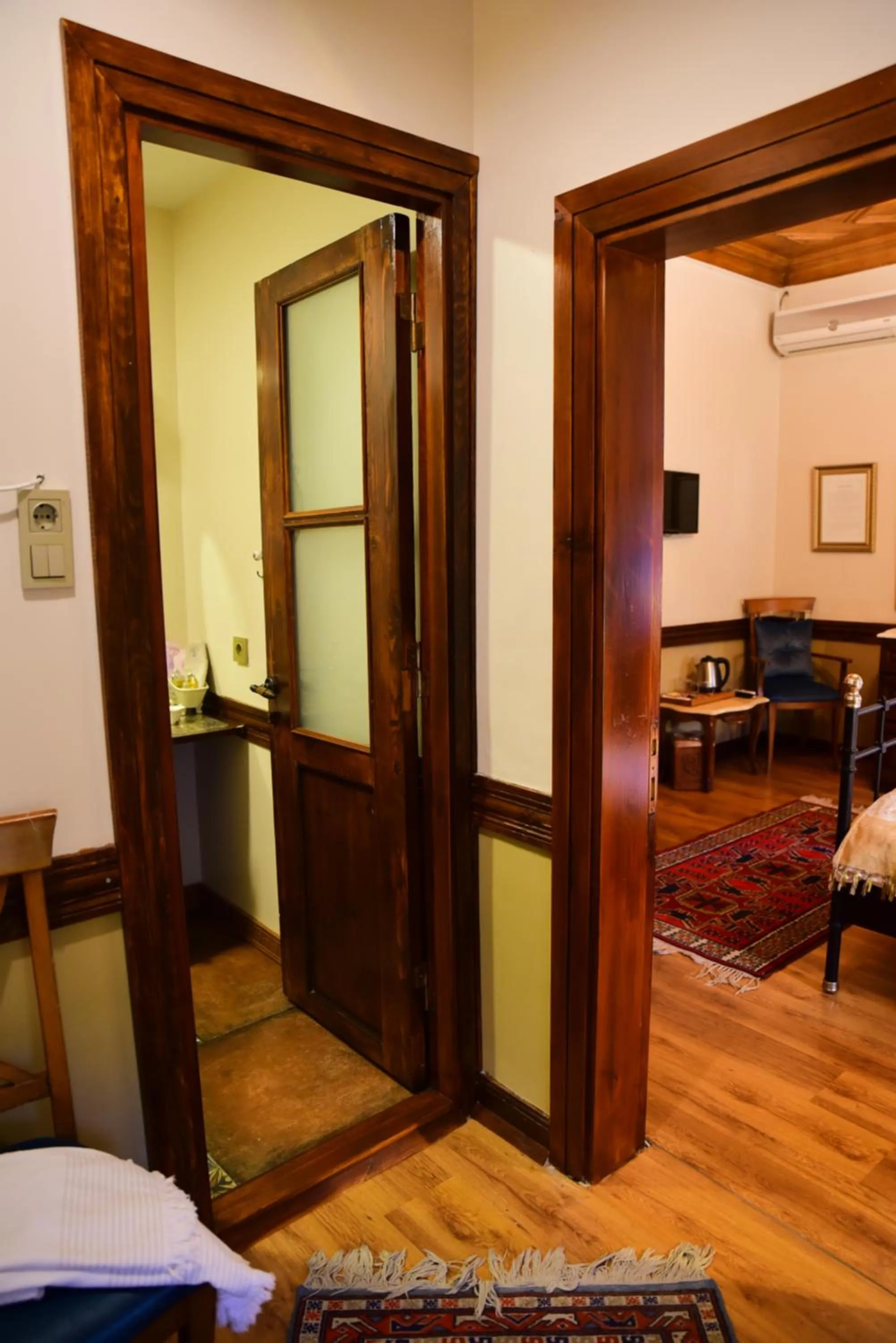 Seating area, Bed in Ottoman Suites by Sera House
