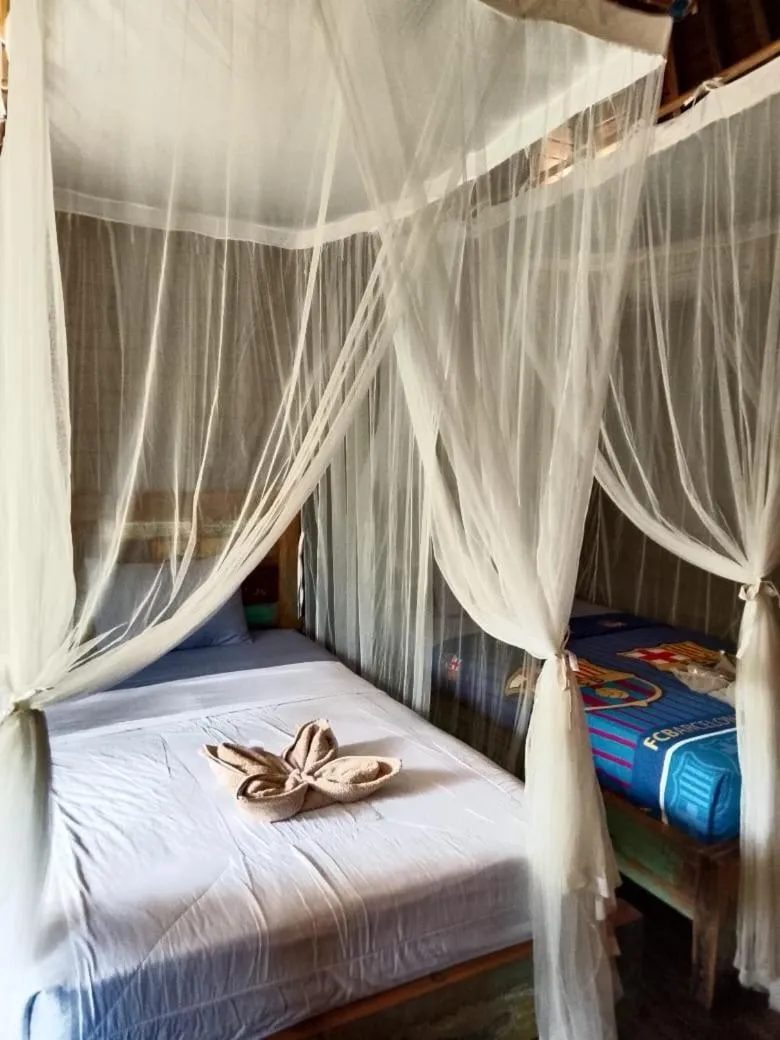 Bed in Raira's Villas Lembongan