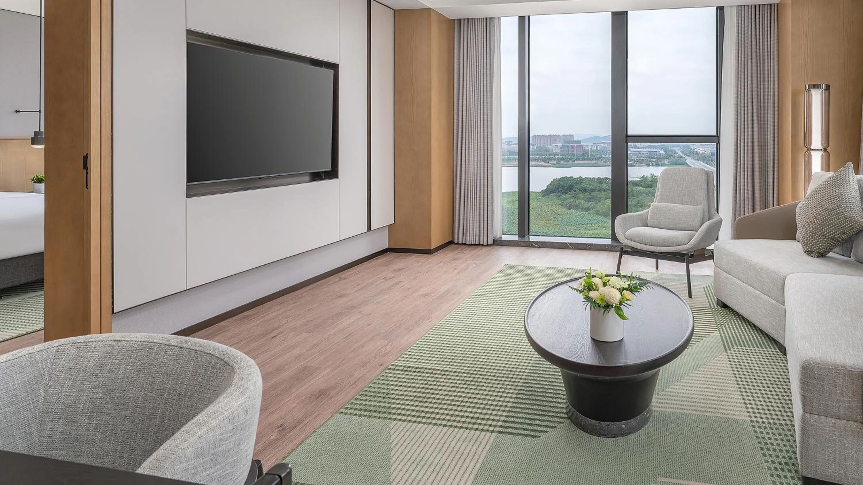 Living room in Holiday Inn Wuhan Houguan Lake by IHG