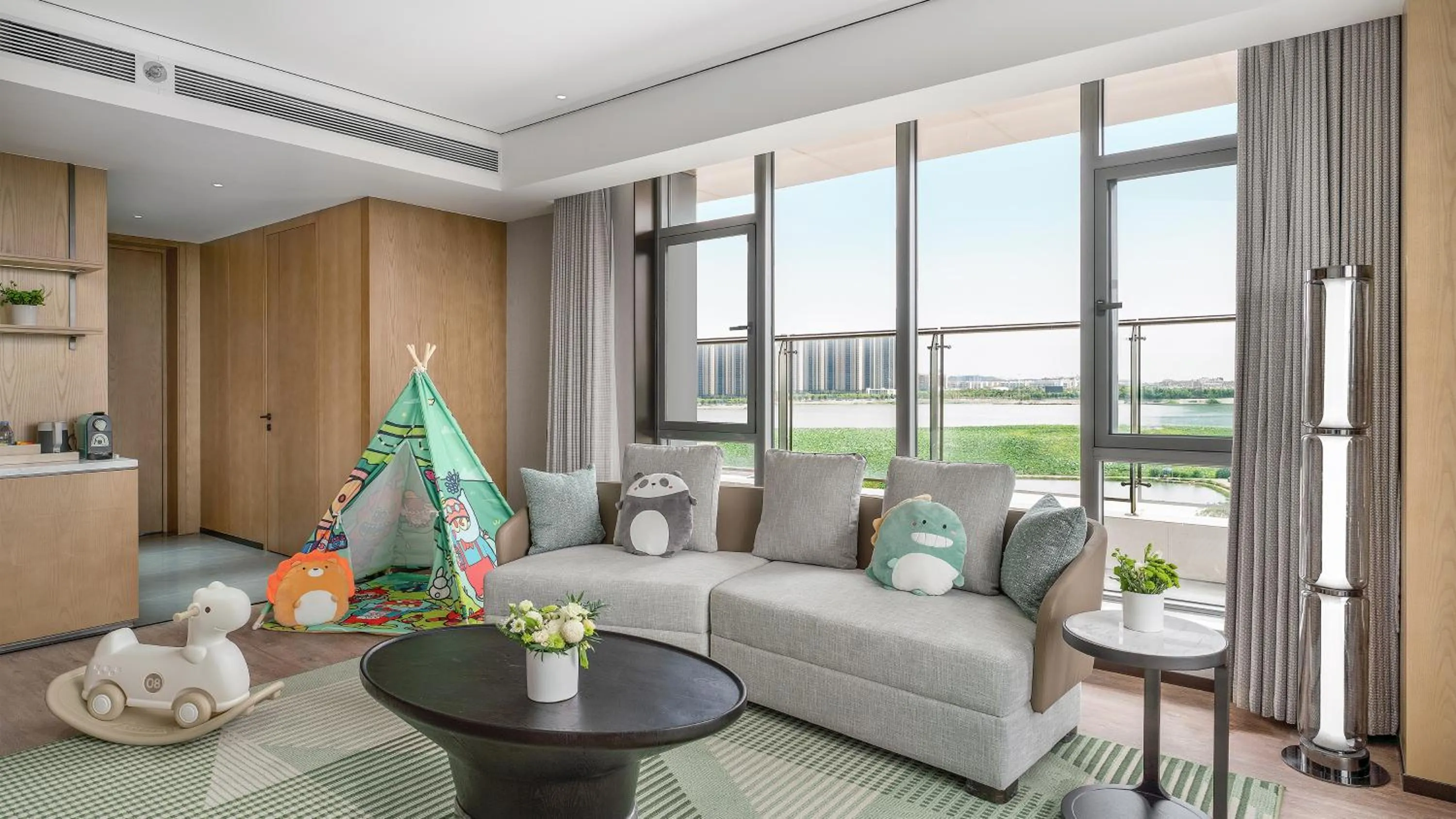 Living room in Holiday Inn Wuhan Houguan Lake by IHG