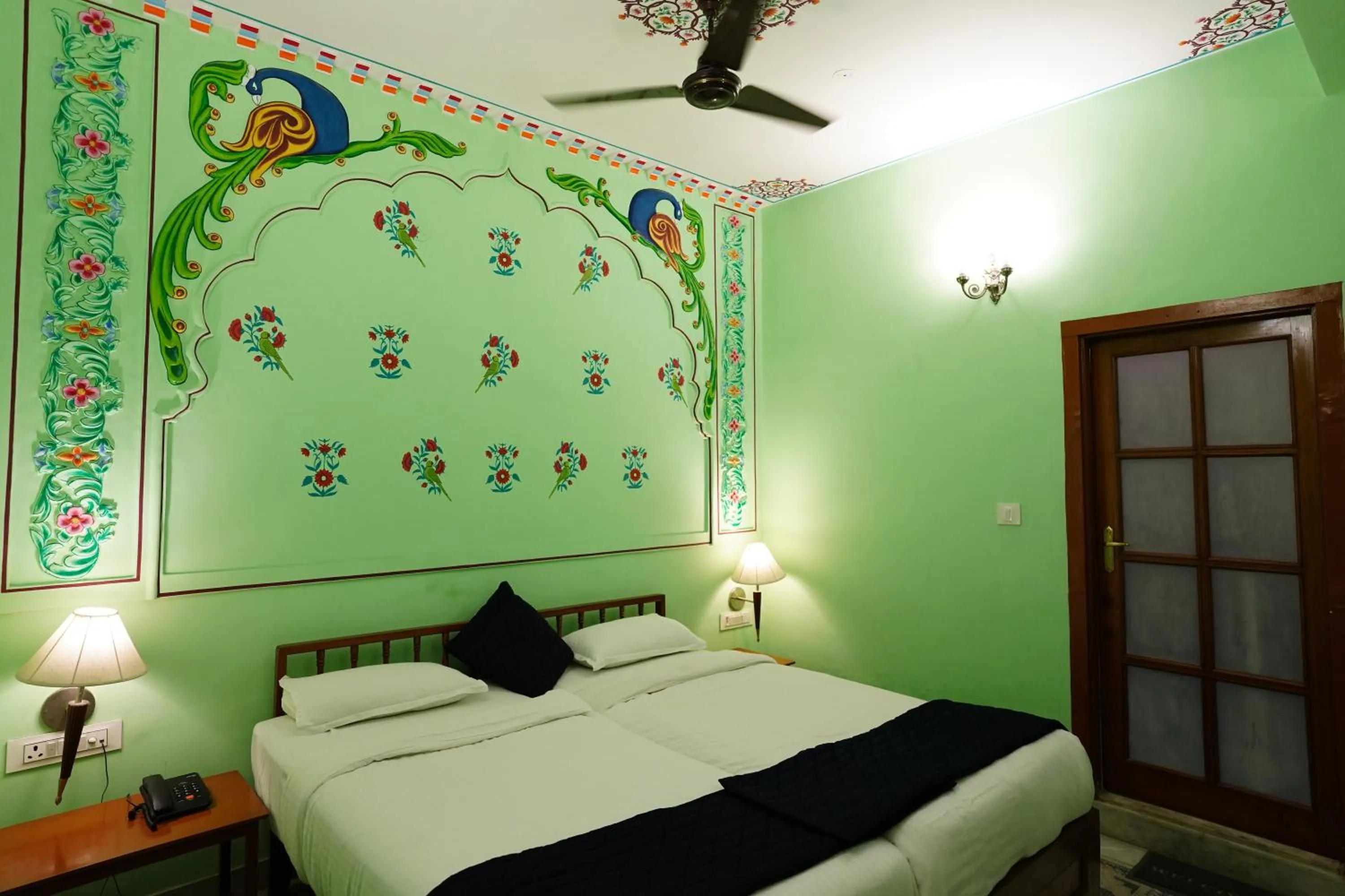 Bed in Haveli Kalwara - A Heritage Hotel