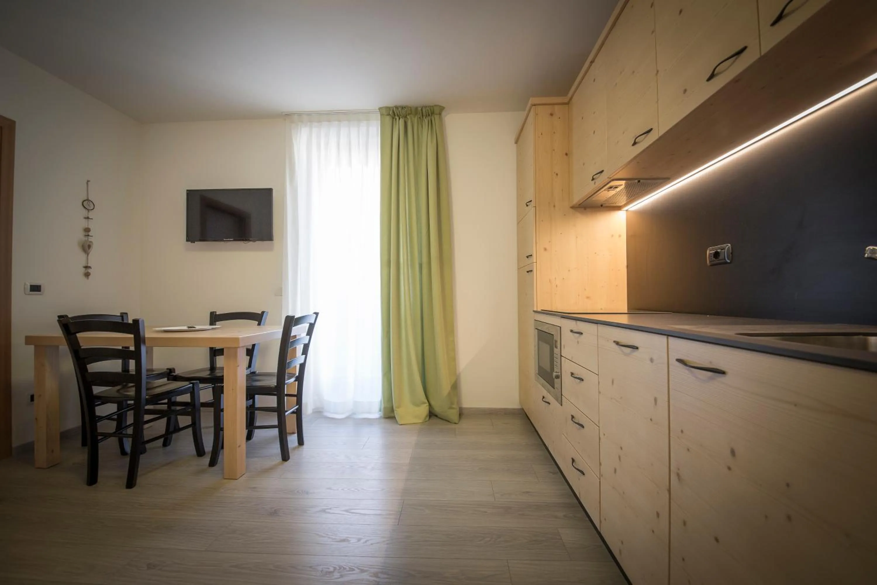 Kitchen or kitchenette in Aparthotel Dolomites Living&Relax