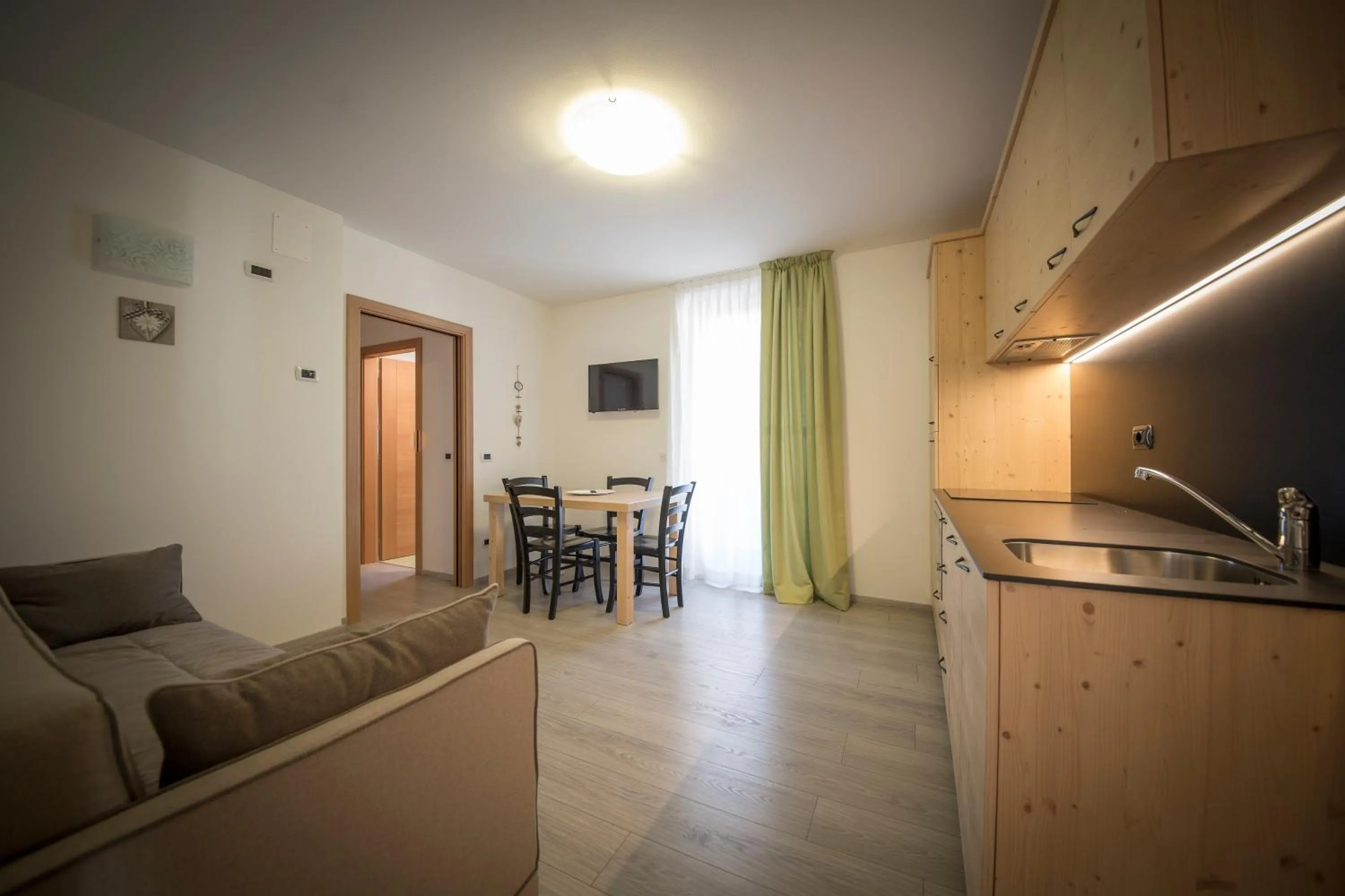 Kitchen or kitchenette in Aparthotel Dolomites Living&Relax