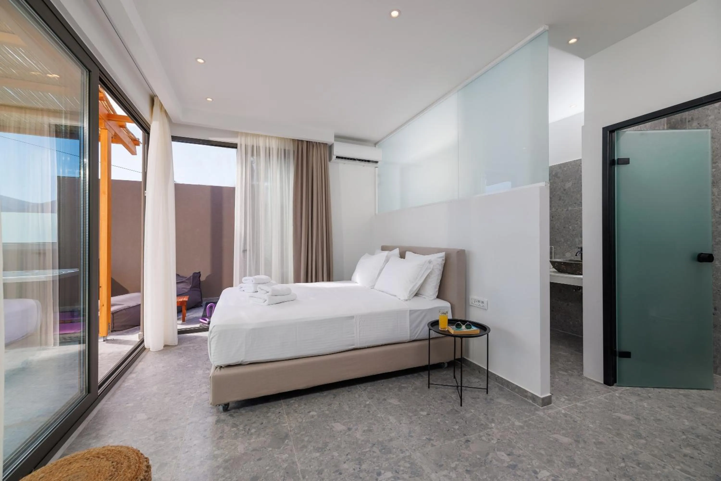 Bed in Soho SeaFront Suites