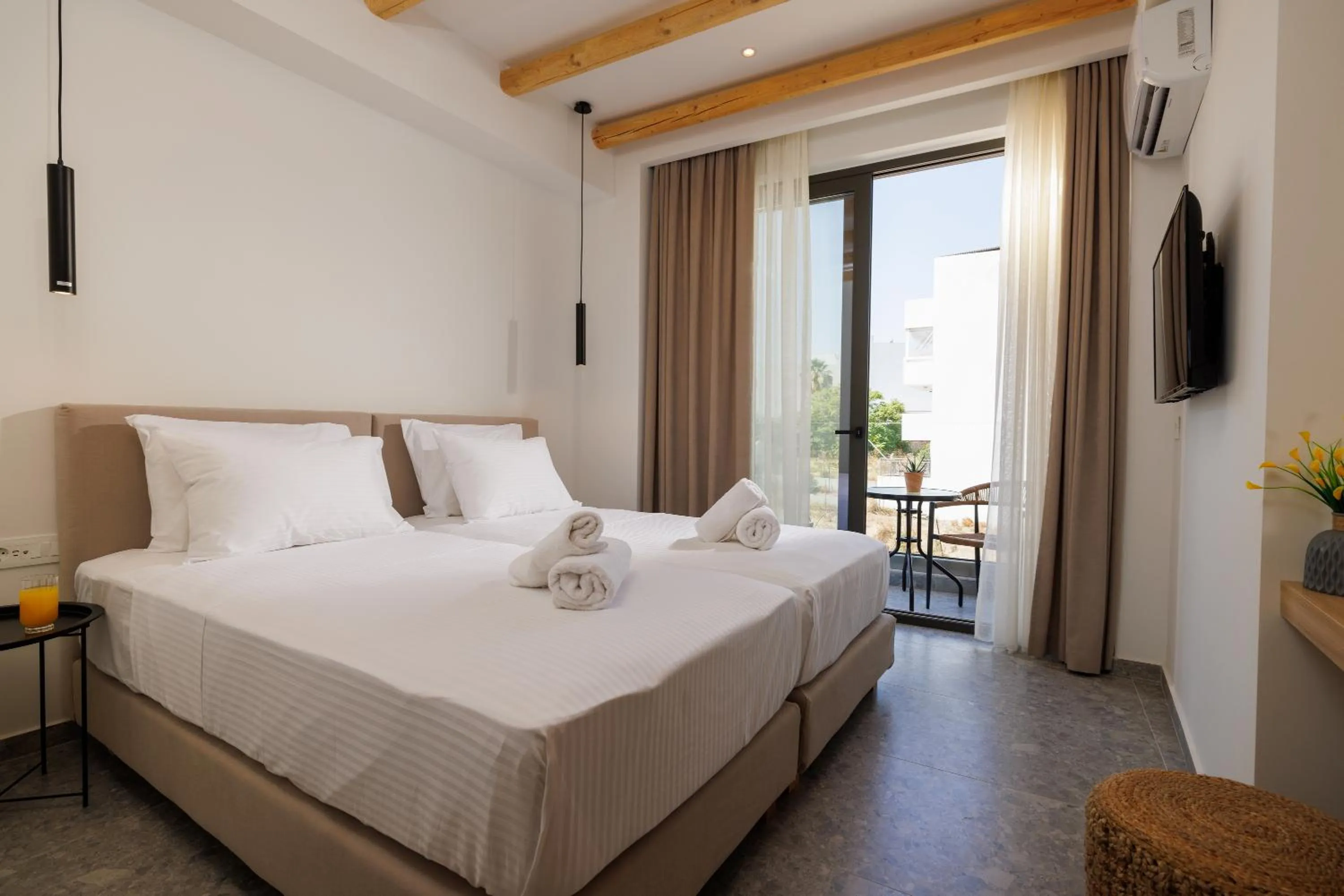 Bed in Soho SeaFront Suites