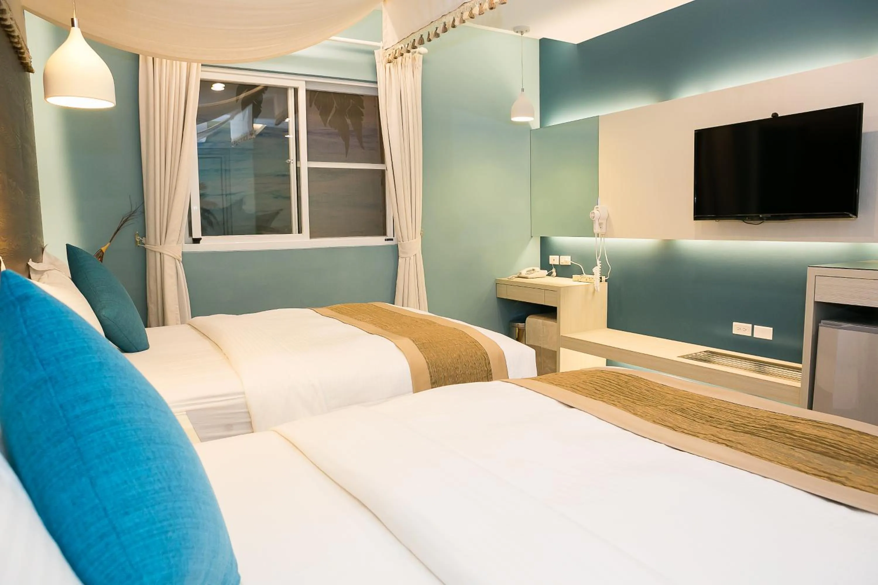 Bed in Bai Sha Tan Cottage