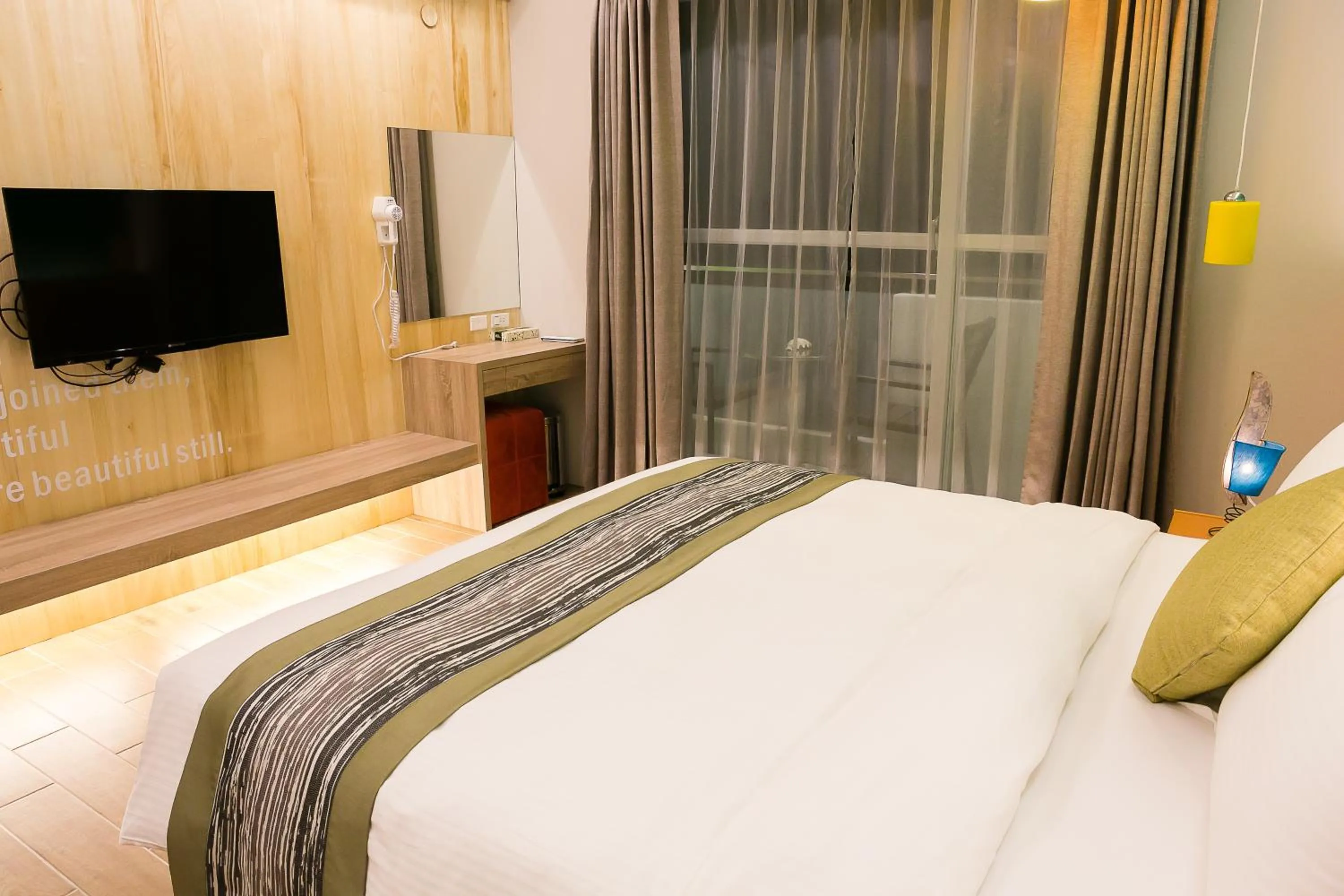 Bed in Bai Sha Tan Cottage