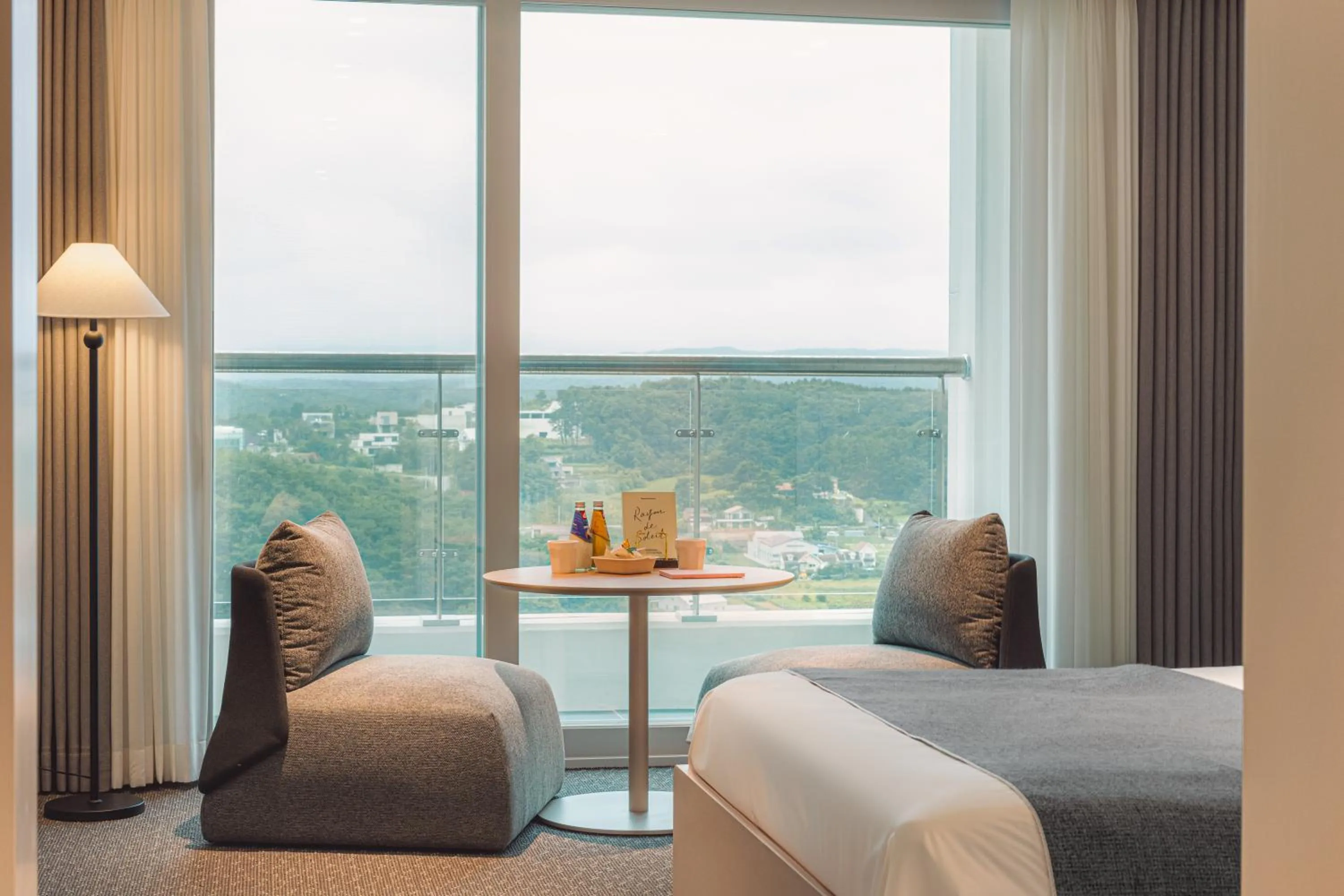 Seating area, Bed in Urbanstay Naksan Beach