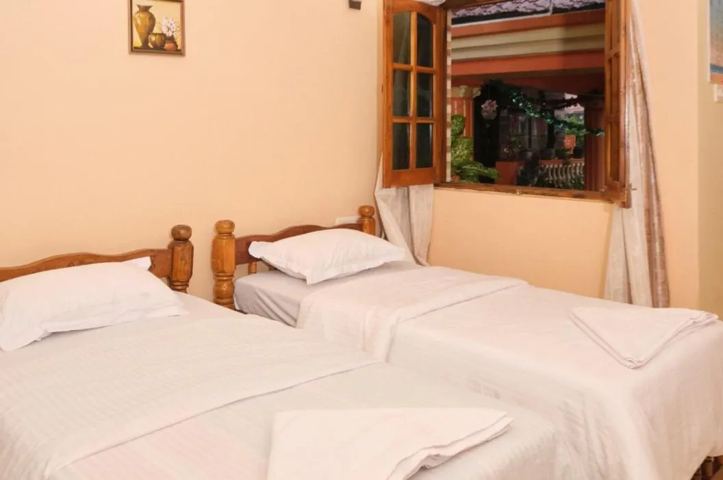 Bed in Rodrigues Residency Goa
