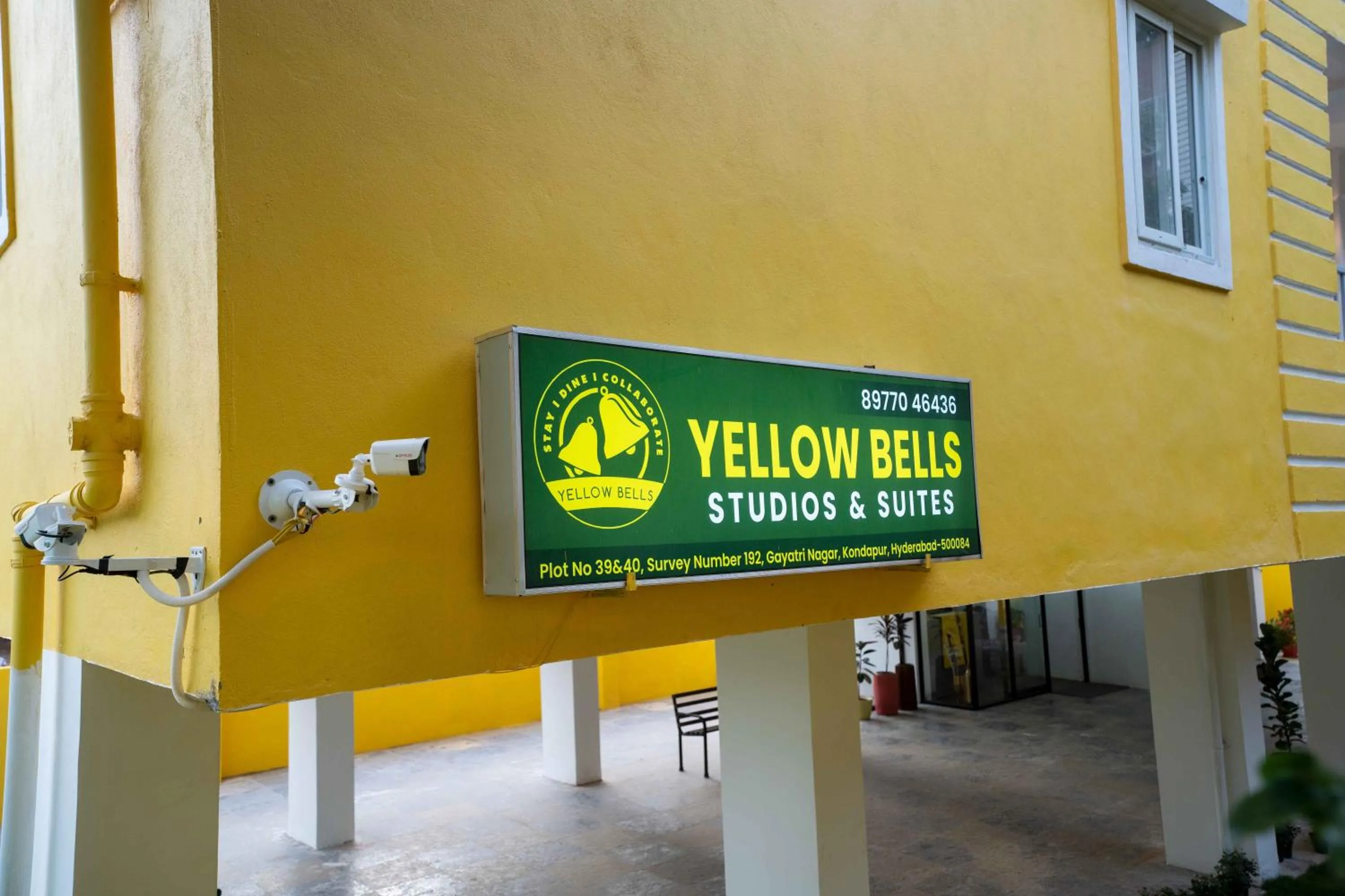 Property logo or sign in Yellow Bells Studios And Suites