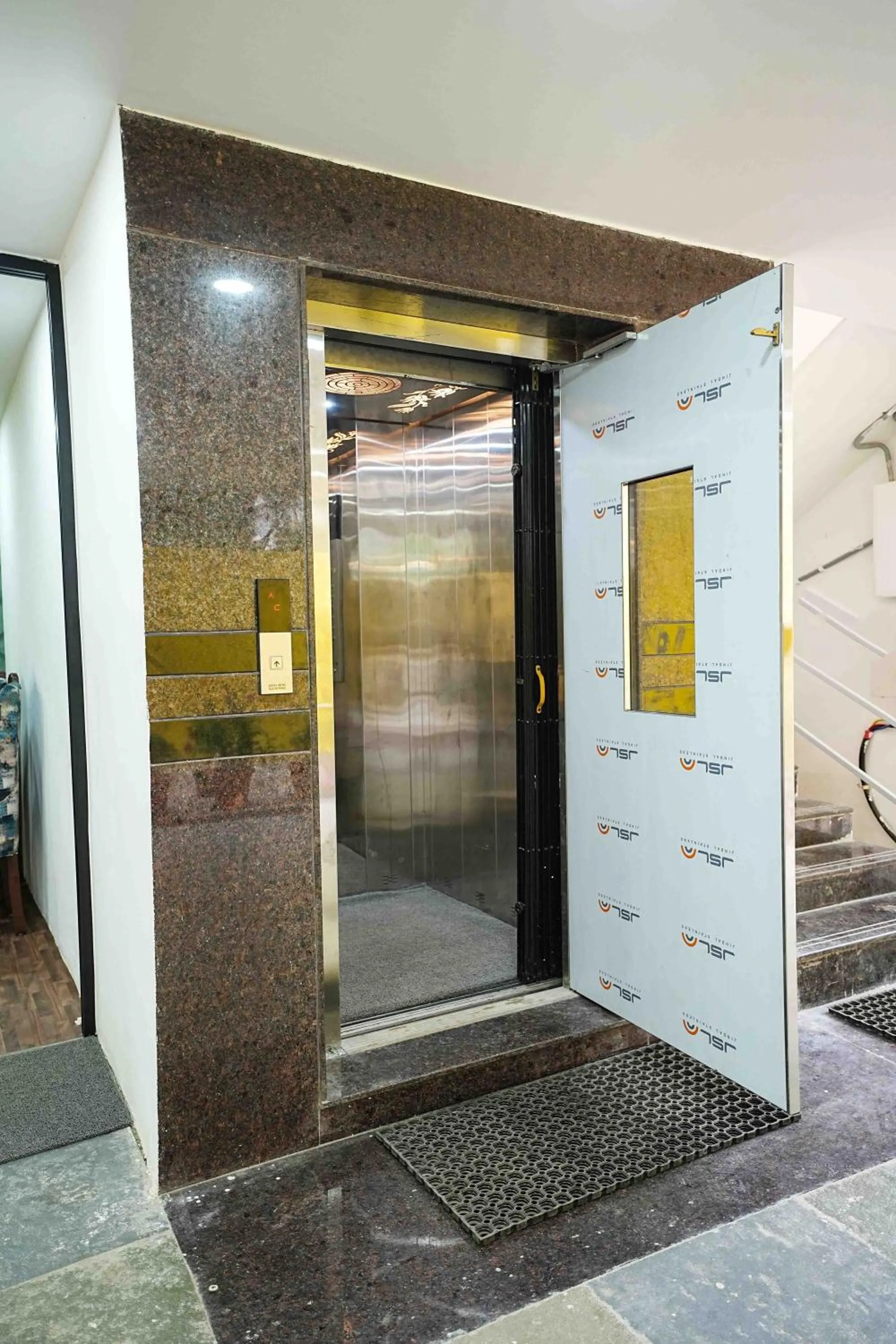 elevator in Yellow Bells Studios And Suites