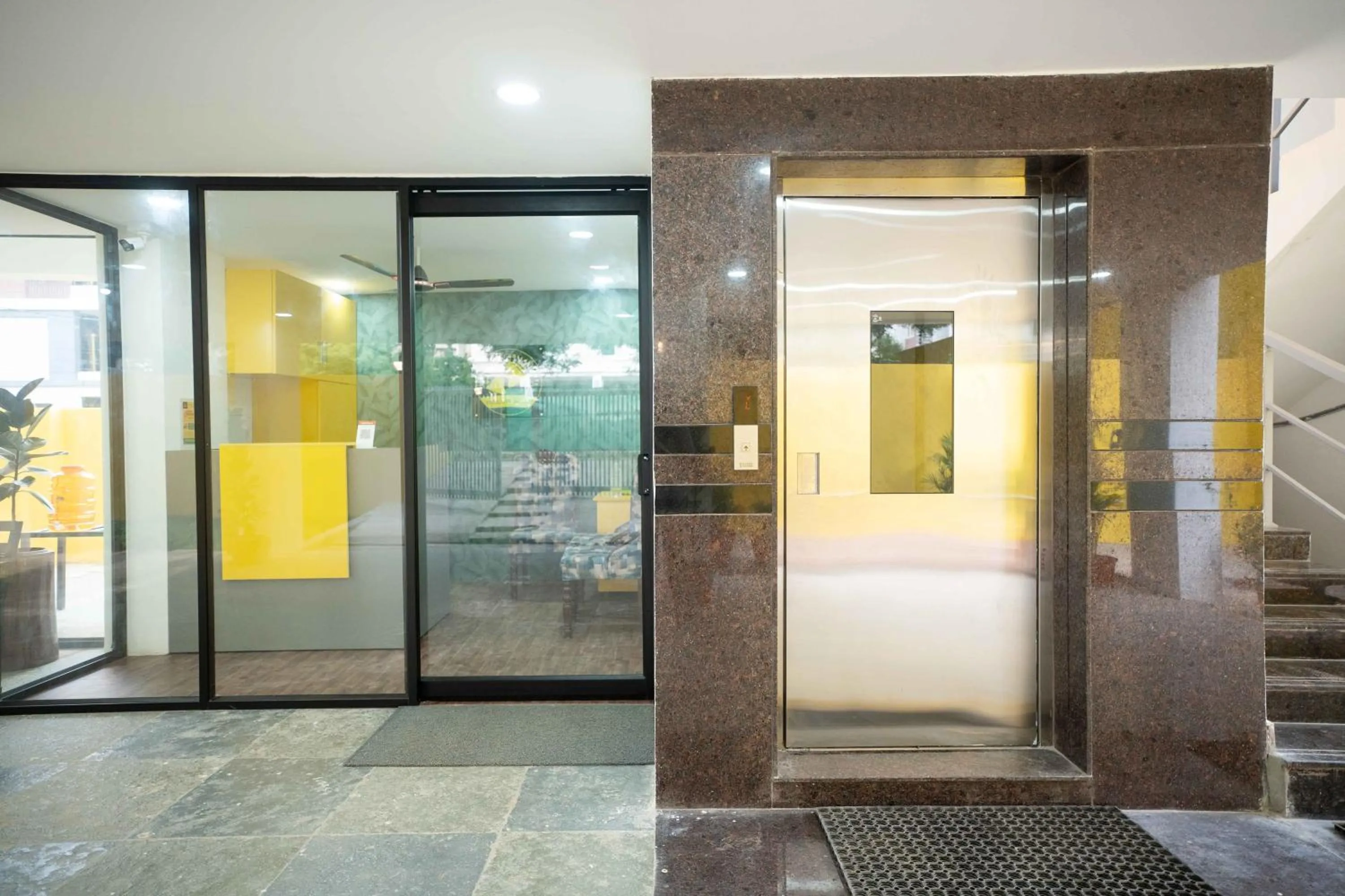elevator in Yellow Bells Studios And Suites