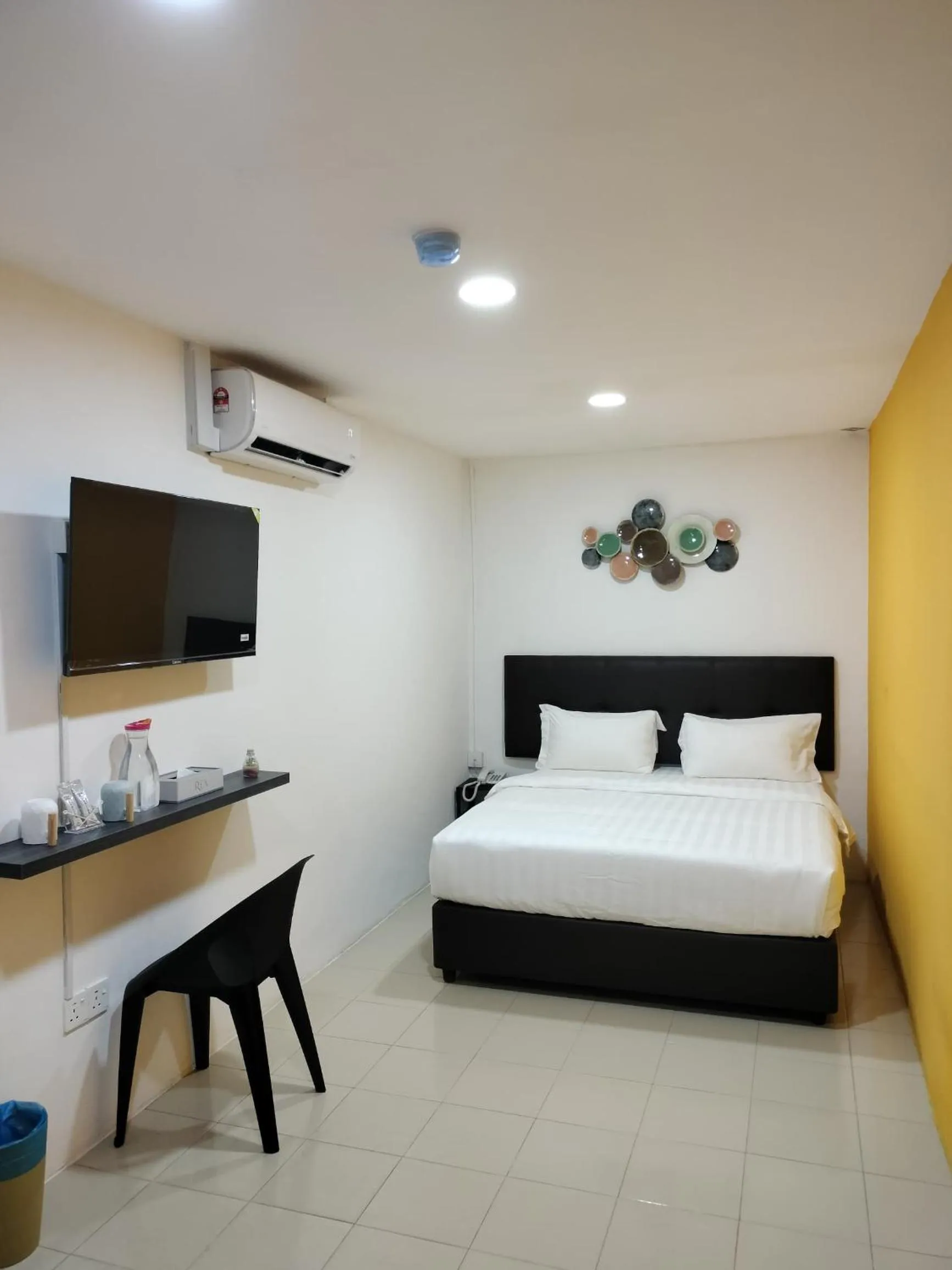 Bed in Rex City Hotel