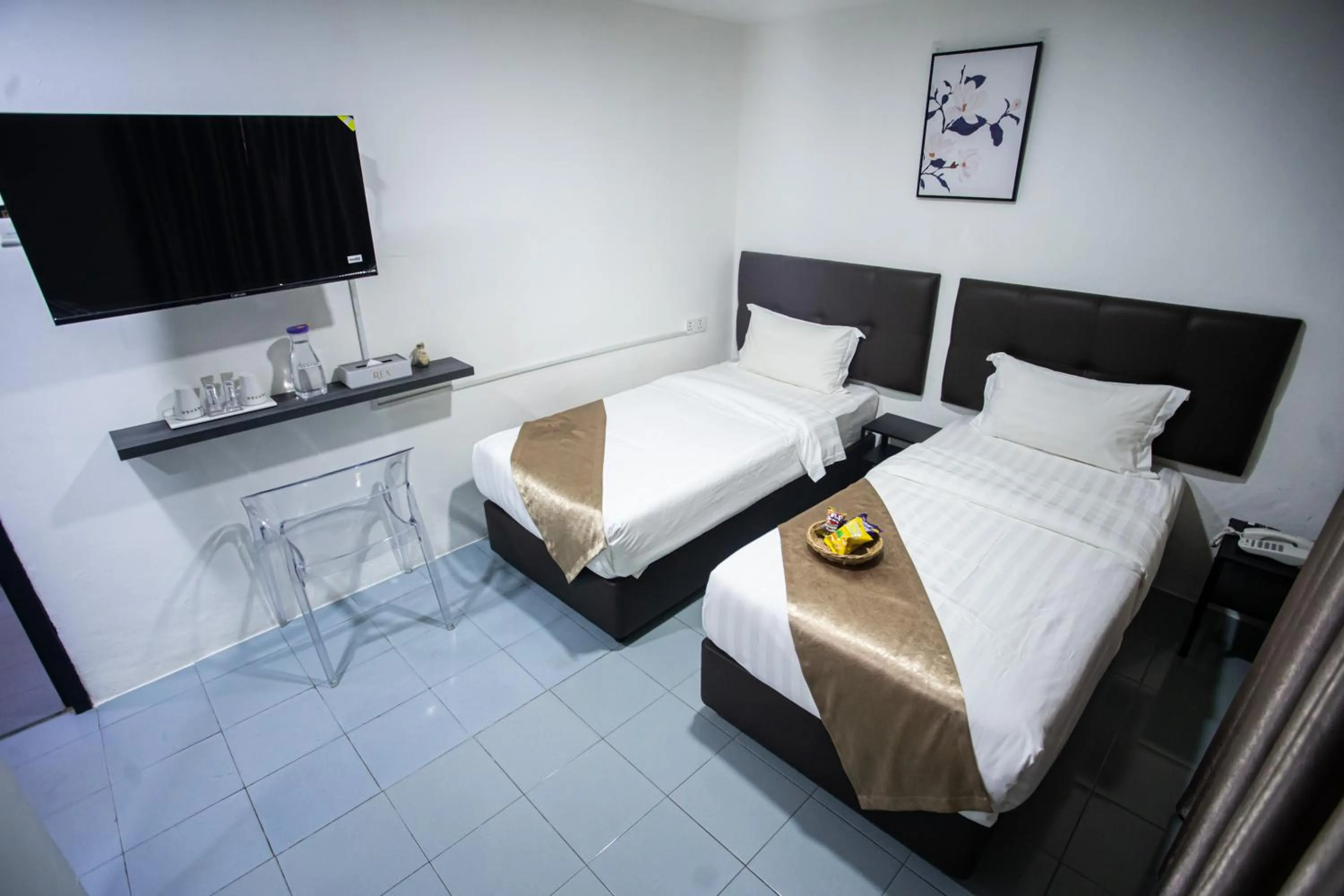 Bed in Rex City Hotel