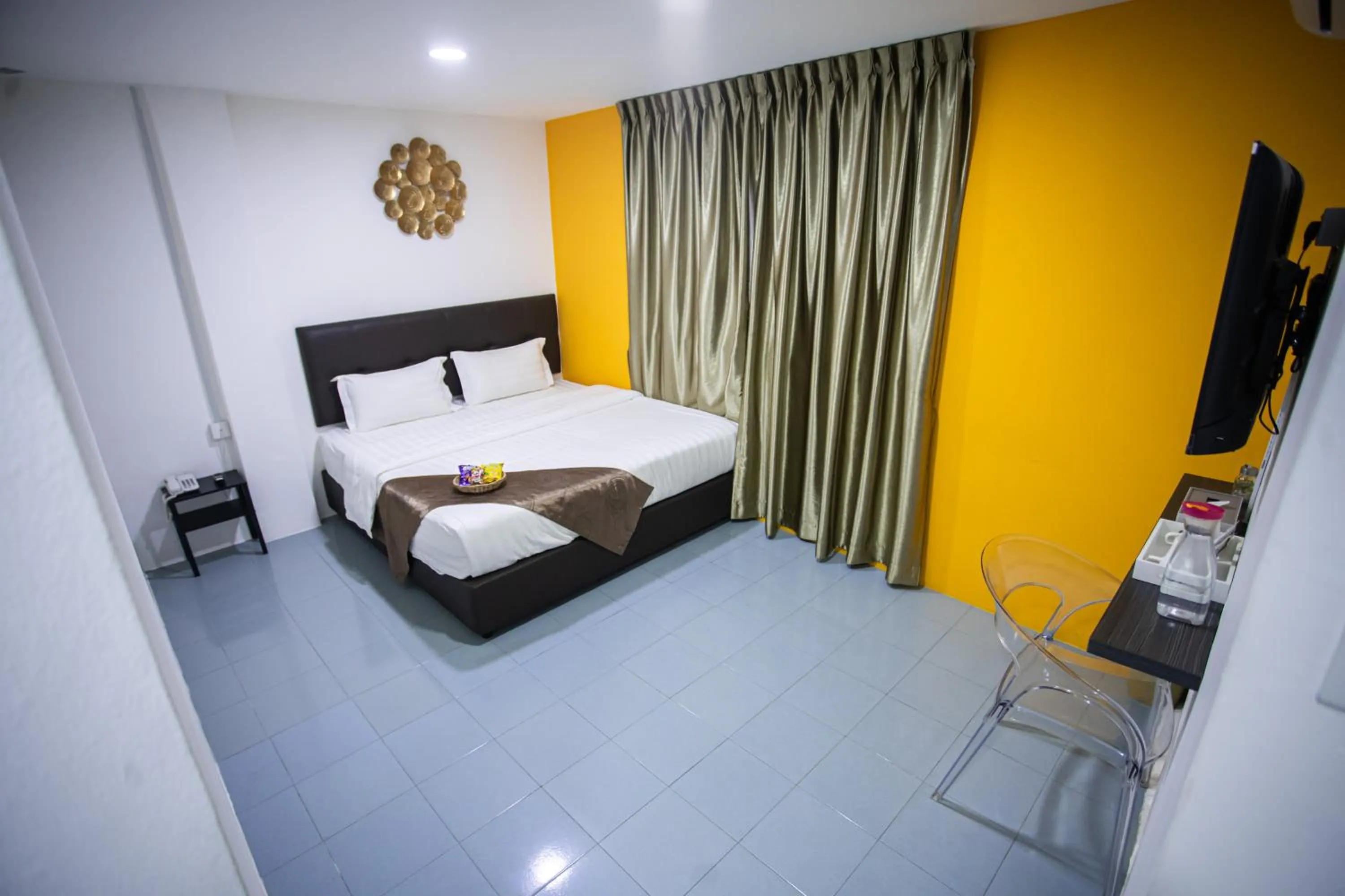 Bed in Rex City Hotel