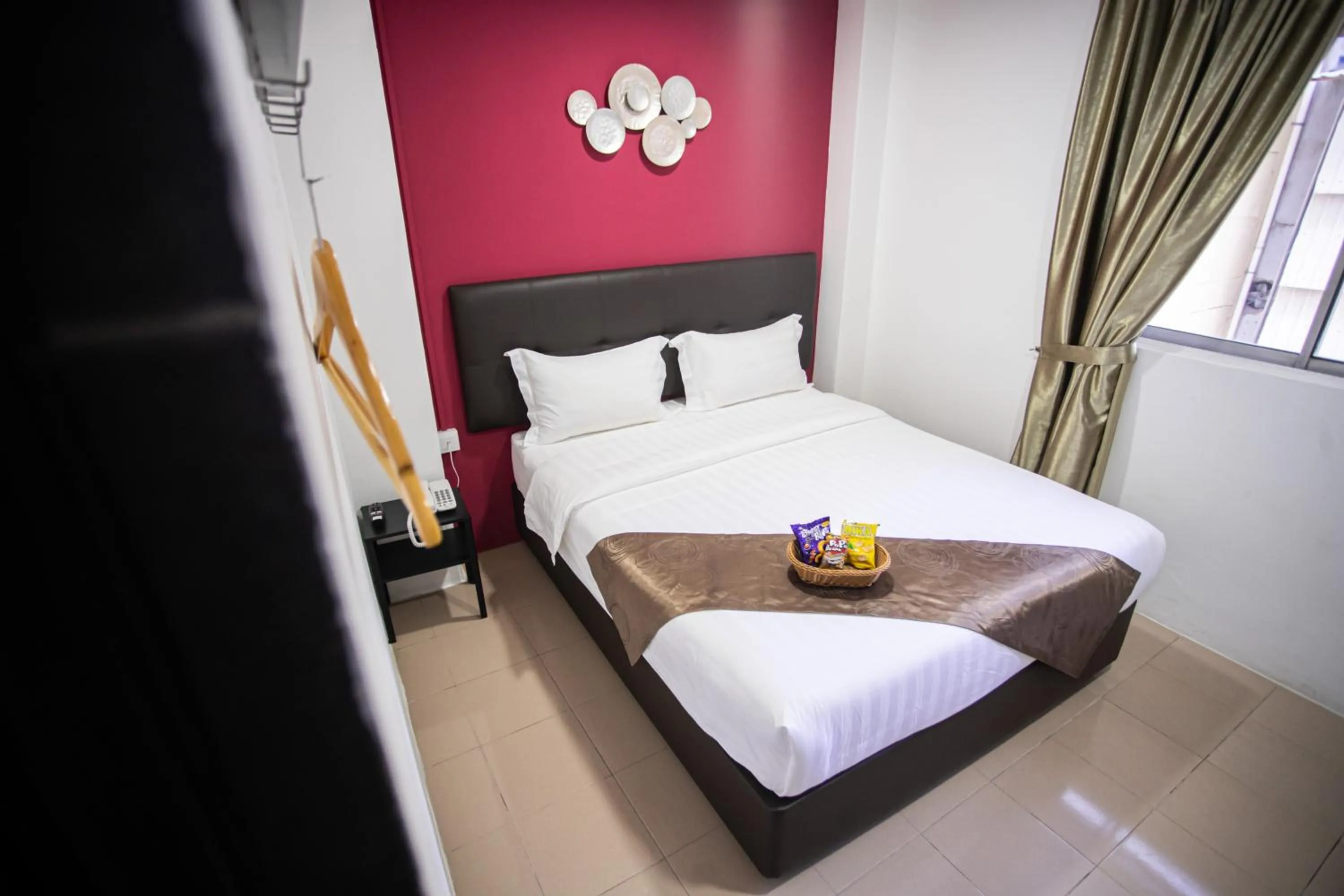 Bed in Rex City Hotel