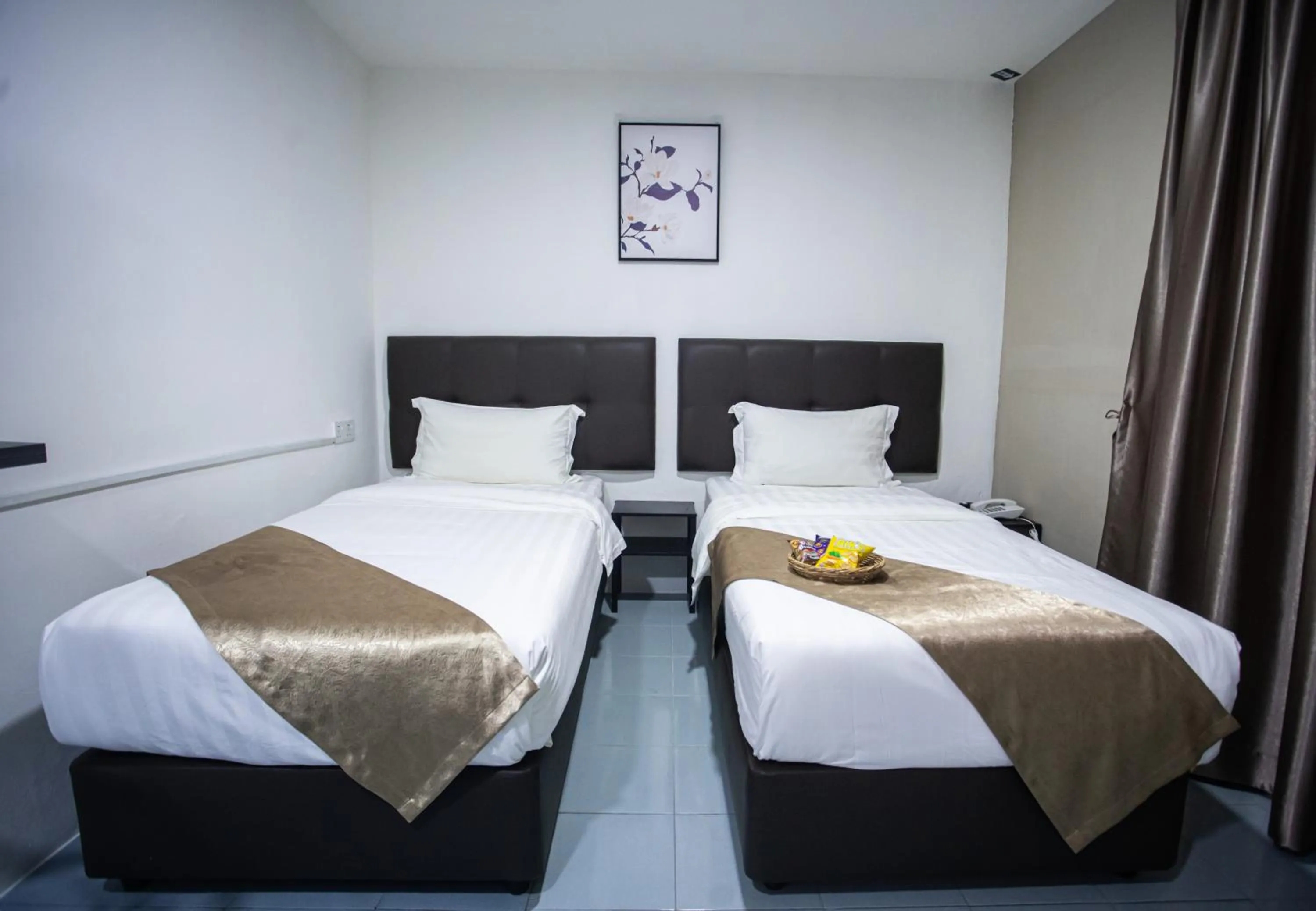 Bed in Rex City Hotel