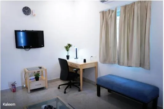 Living room, Bed in Enkay Service Apartments