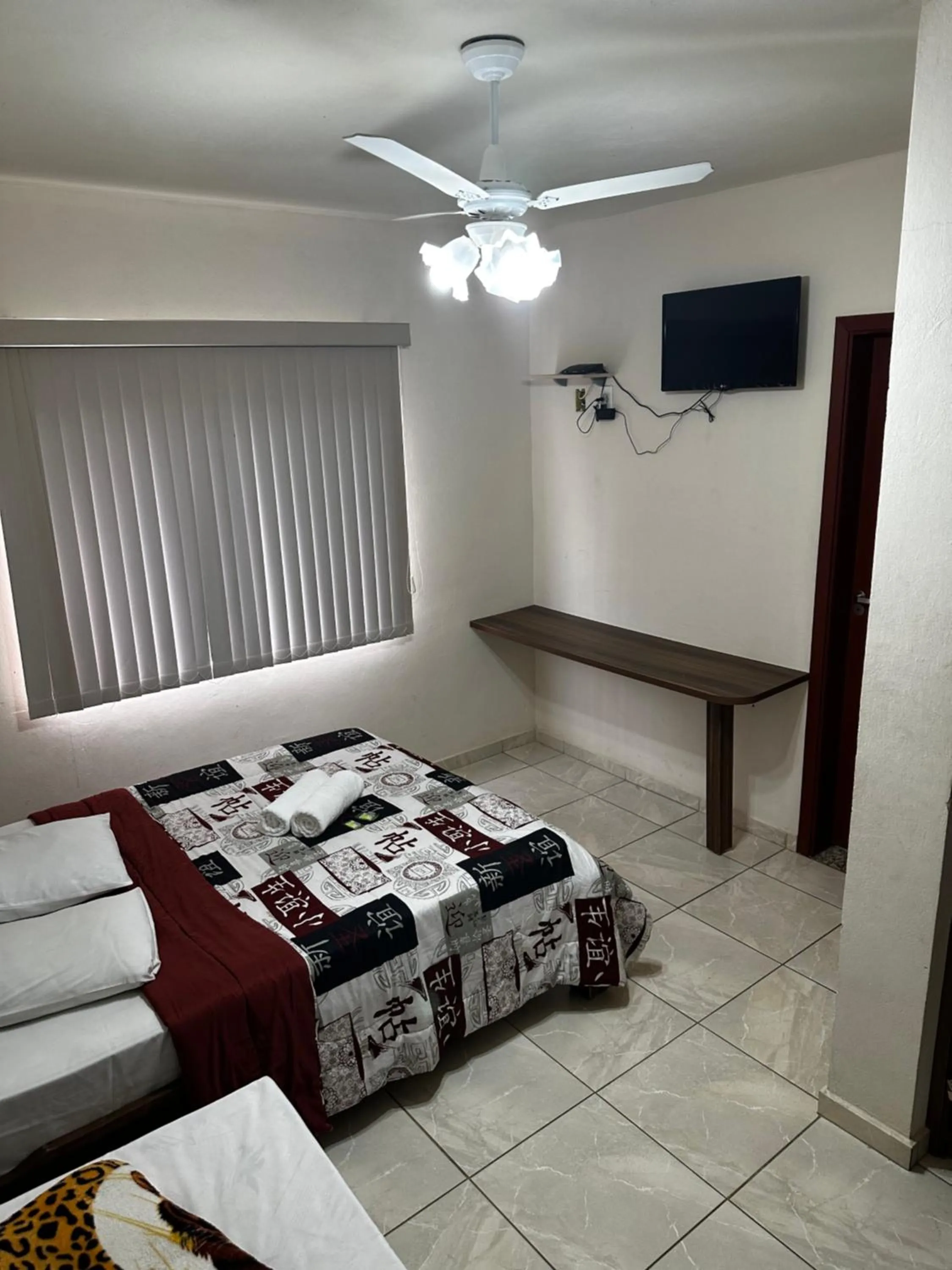 Bed in Pousada Natalino Broleze
