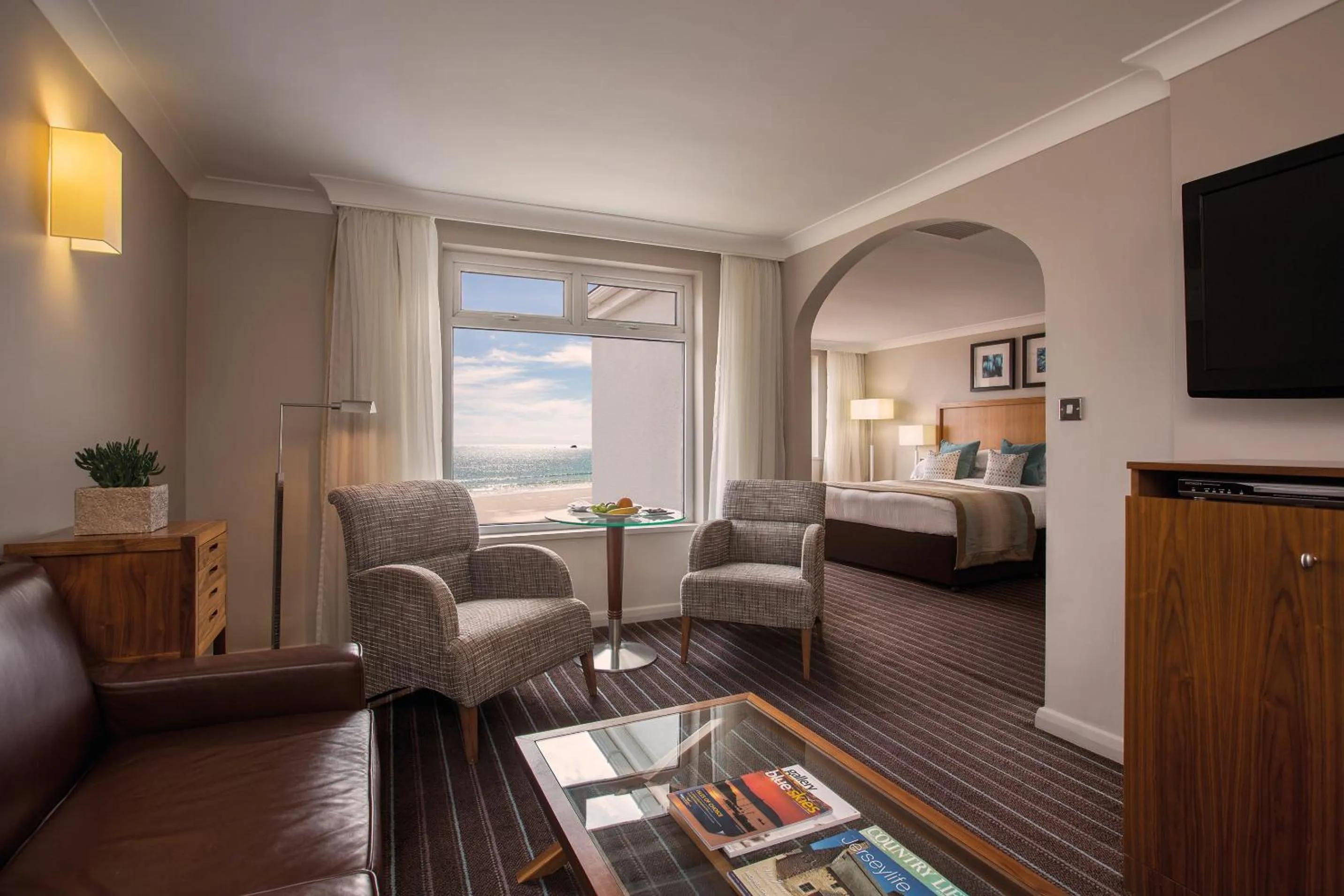 Living room, Bed in L’Horizon Beach Hotel &amp; Spa