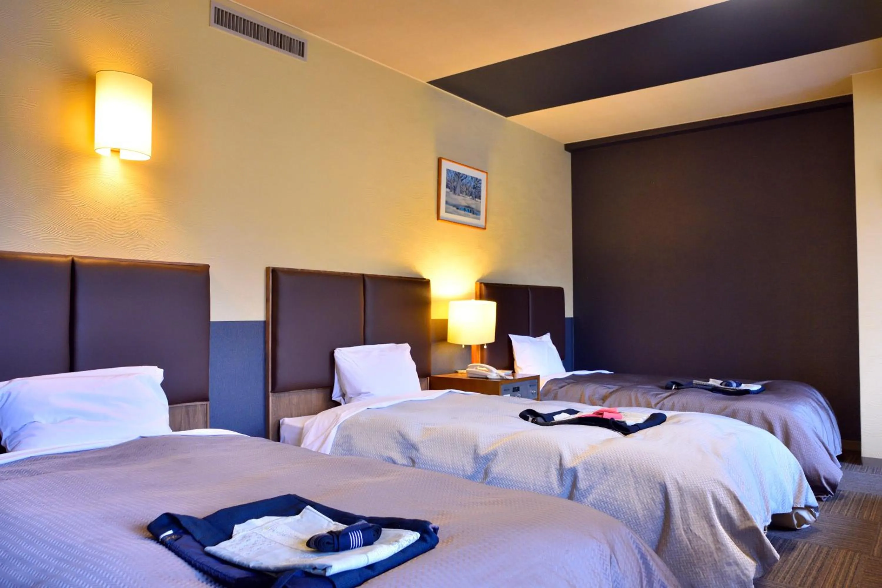 Bed in こんぴら温泉 貸切湯の宿 ことね