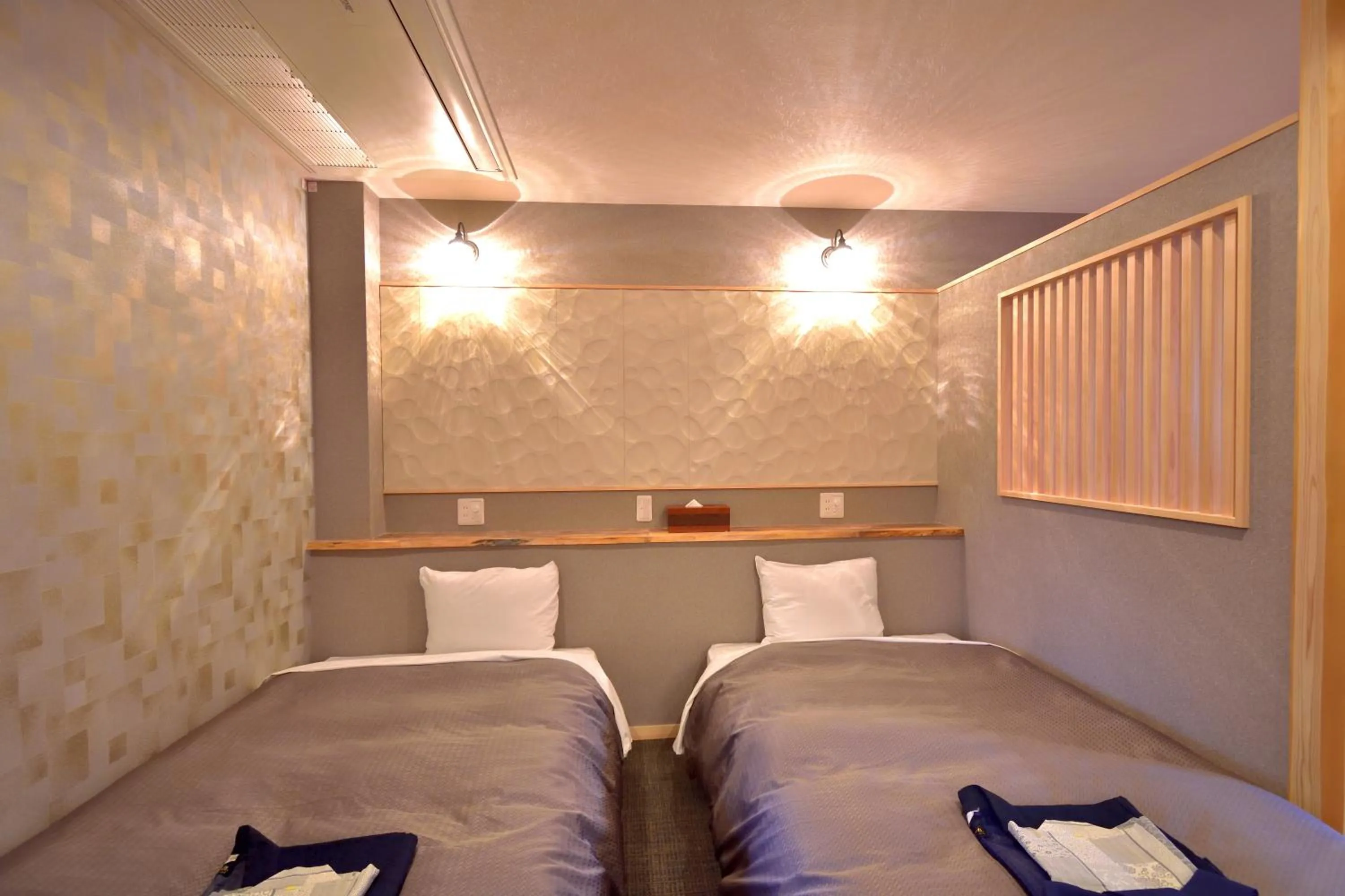 Bed in こんぴら温泉 貸切湯の宿 ことね