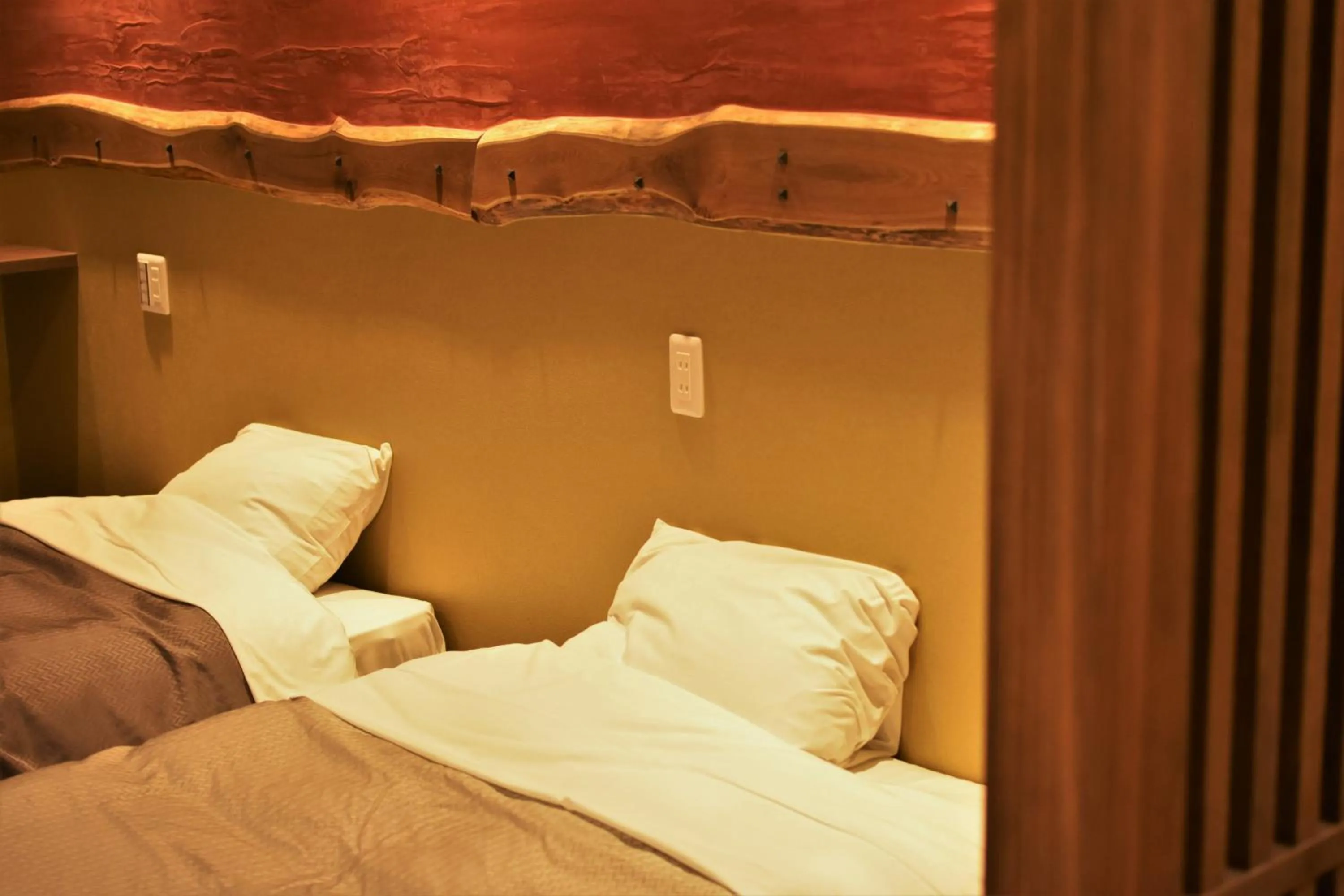 Bed in こんぴら温泉 貸切湯の宿 ことね