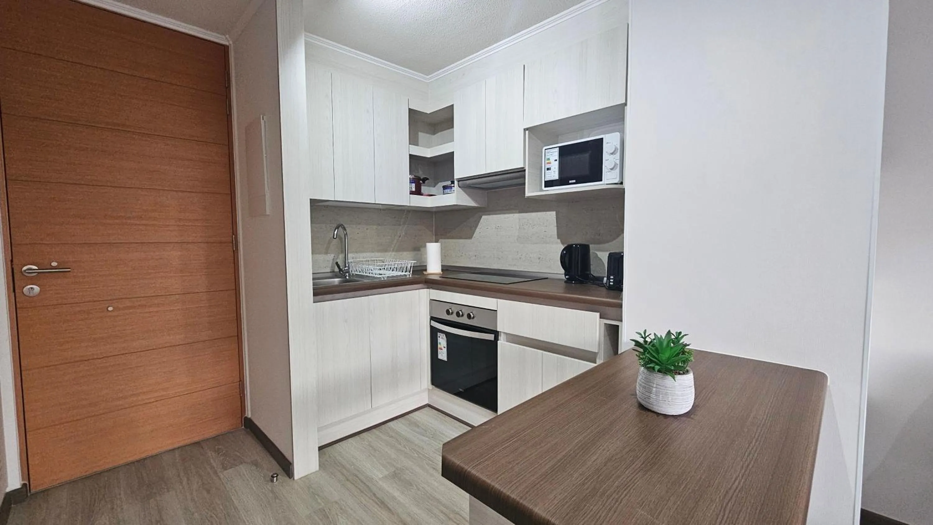 Kitchen or kitchenette in Oceana Suites Distrito Verde