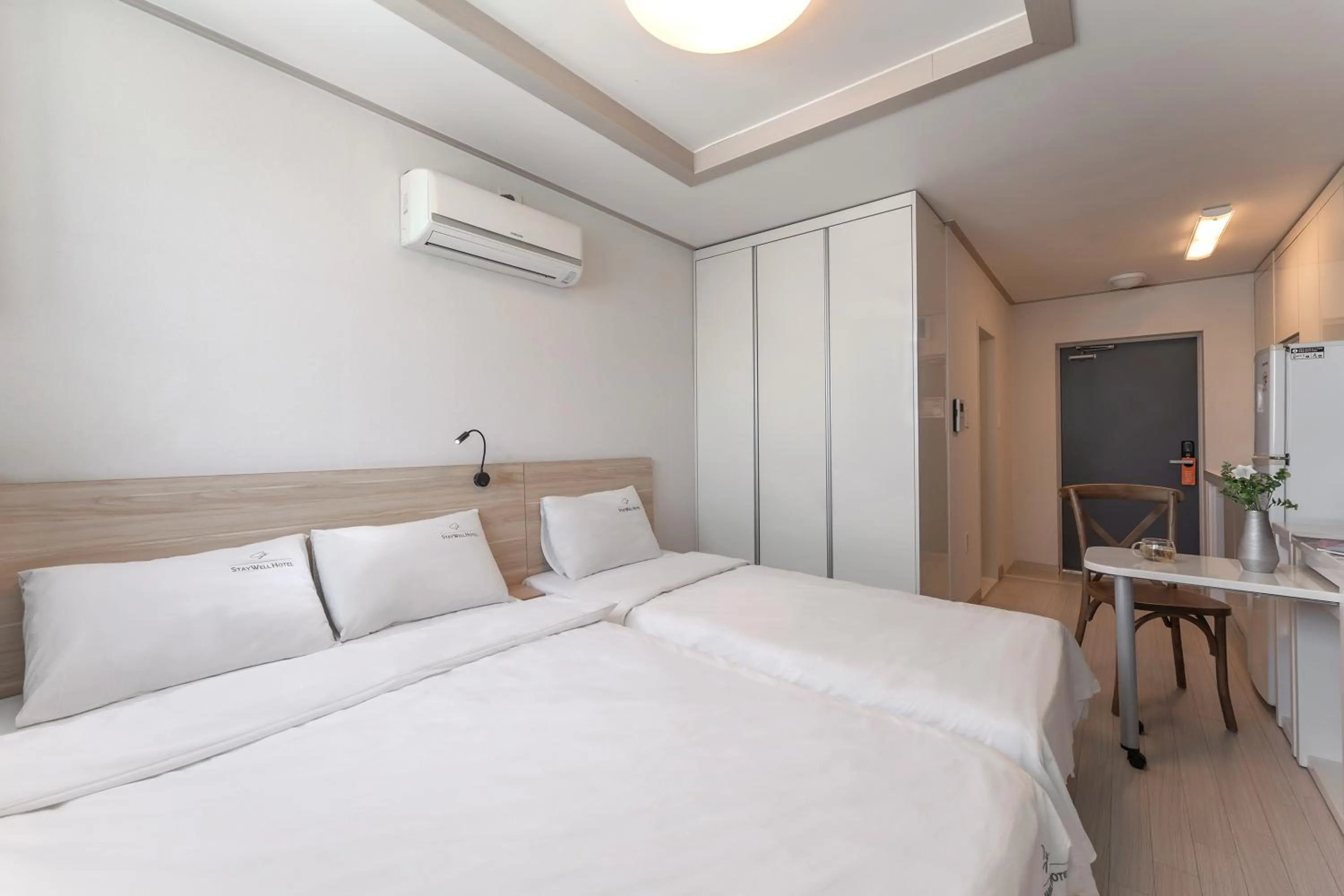 Bed in Staywell Hotel