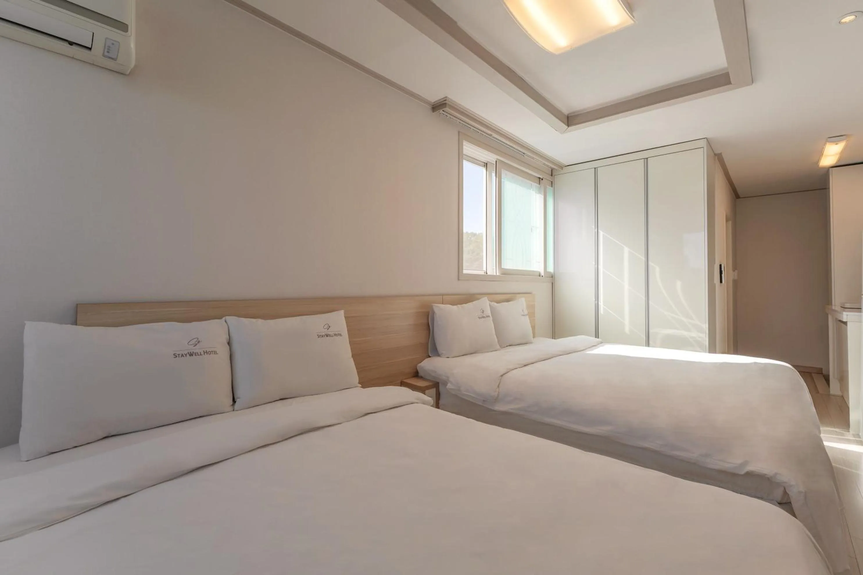 Bed in Staywell Hotel