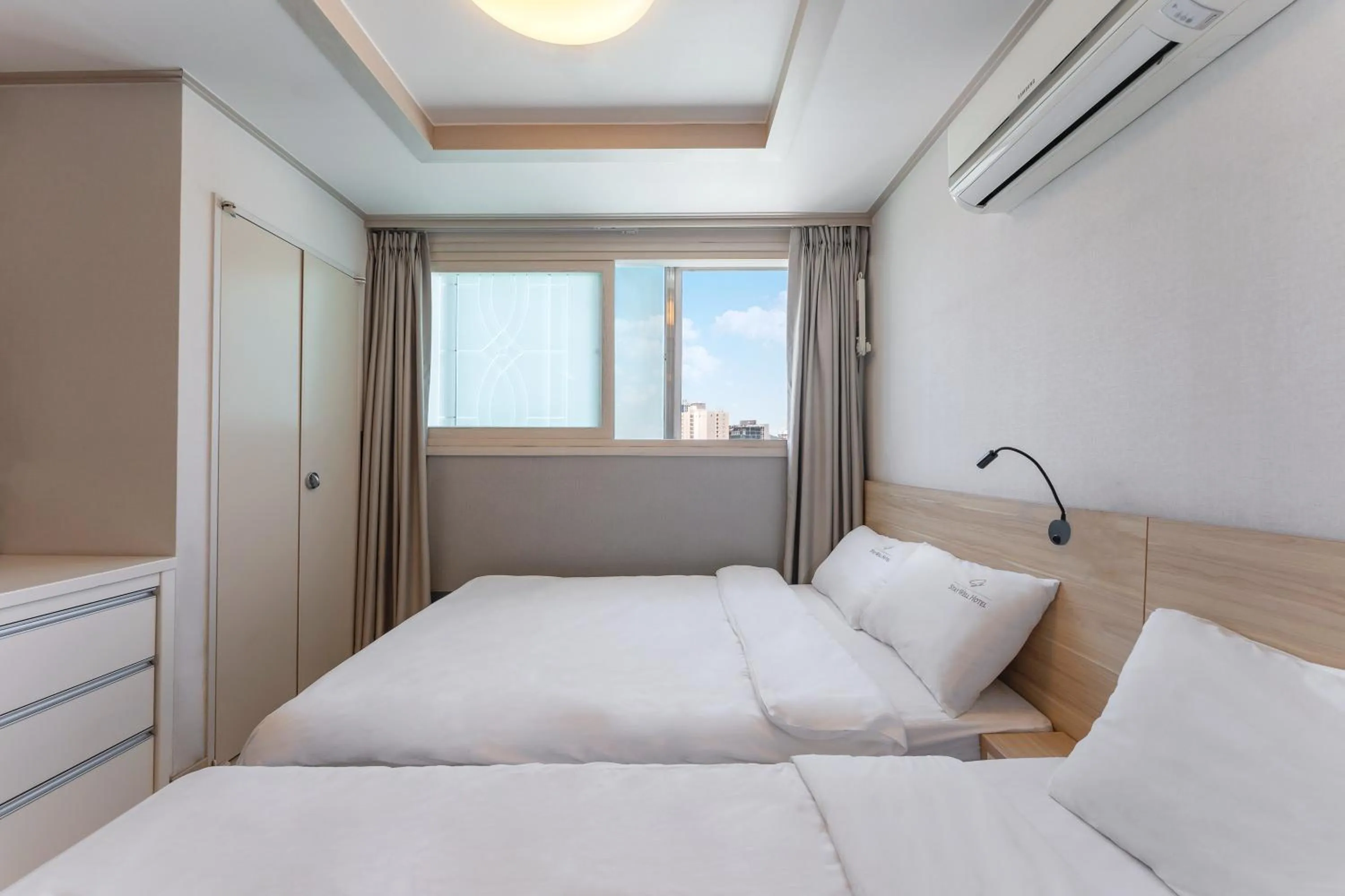 Bed in Staywell Hotel