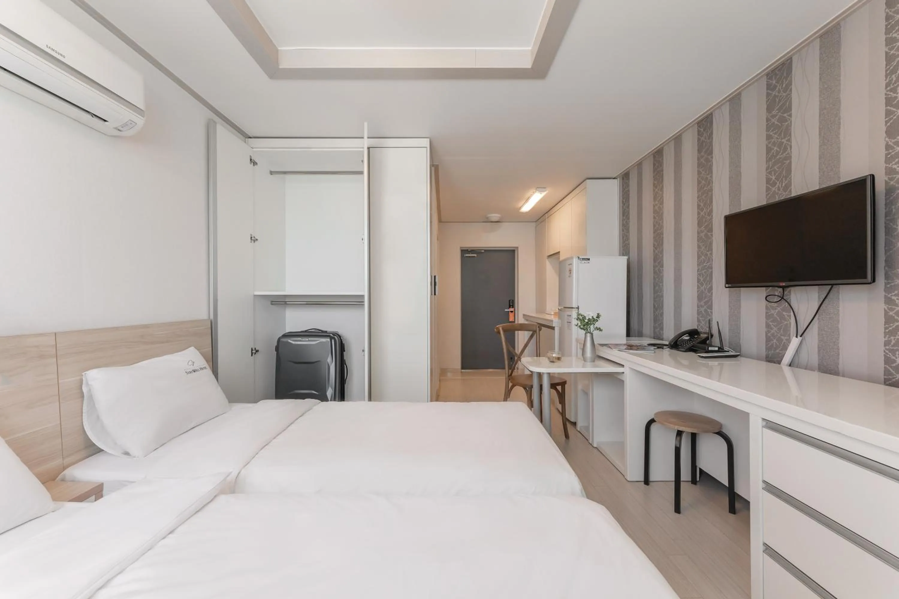 Bed in Staywell Hotel