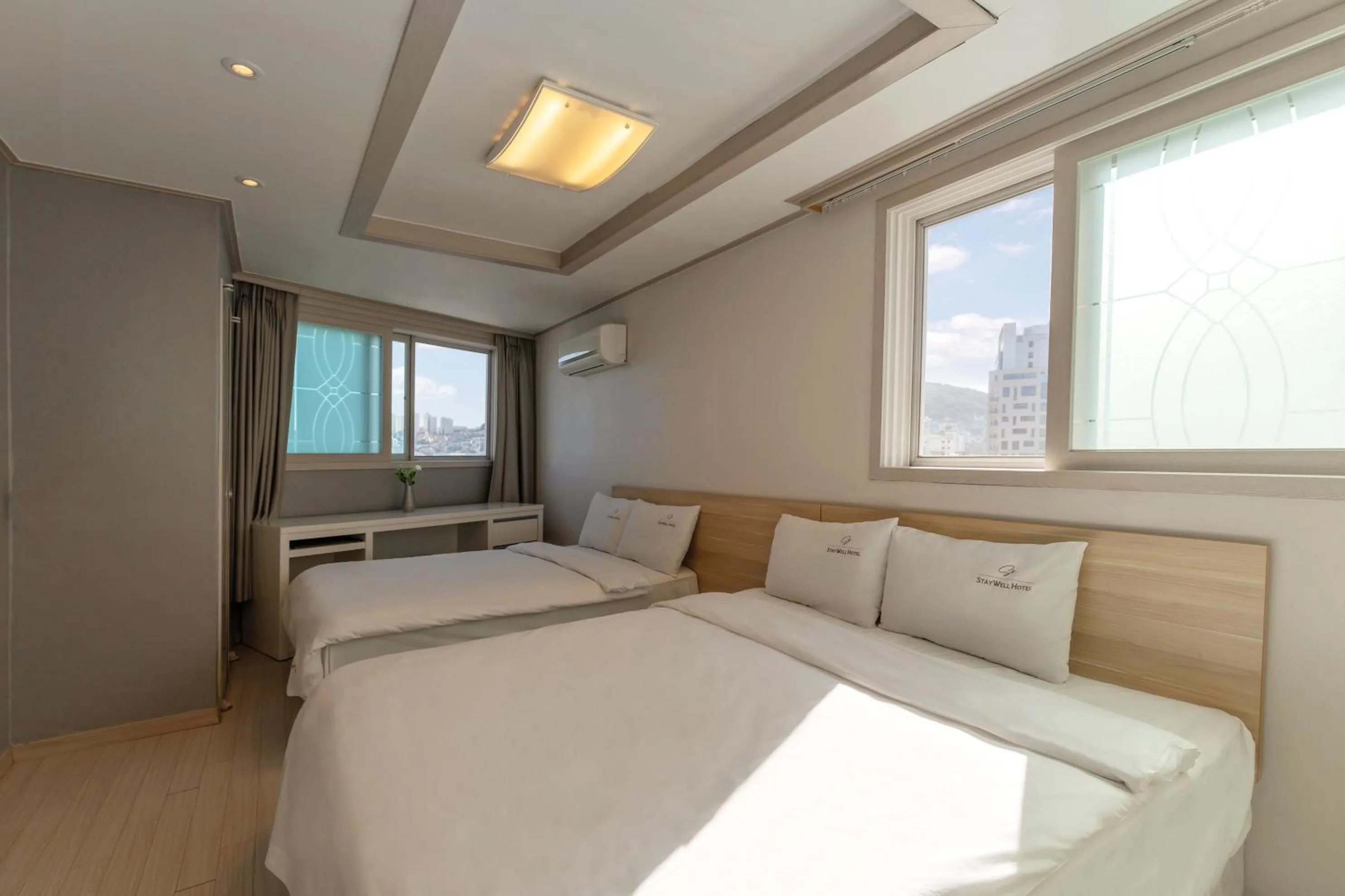 Bed in Staywell Hotel