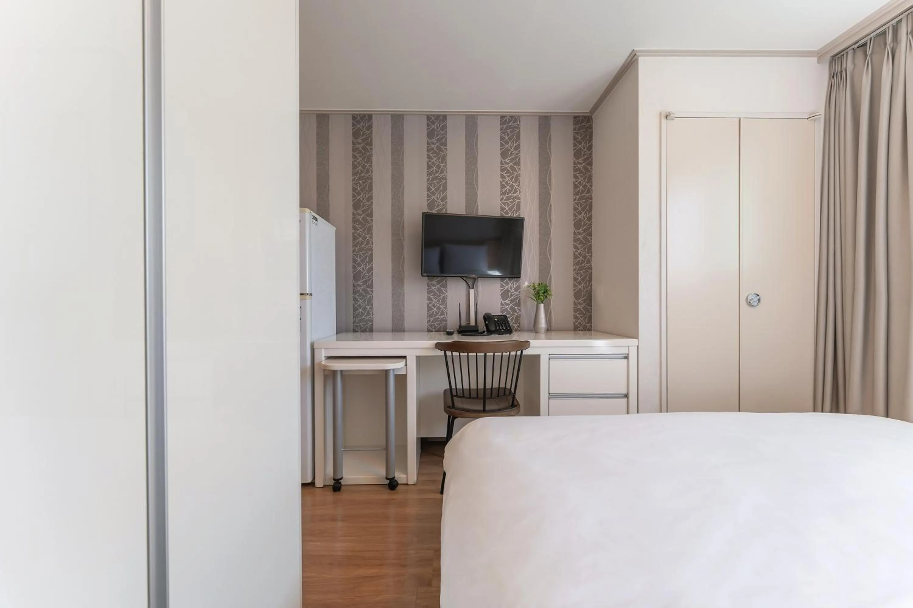 Bed in Staywell Hotel