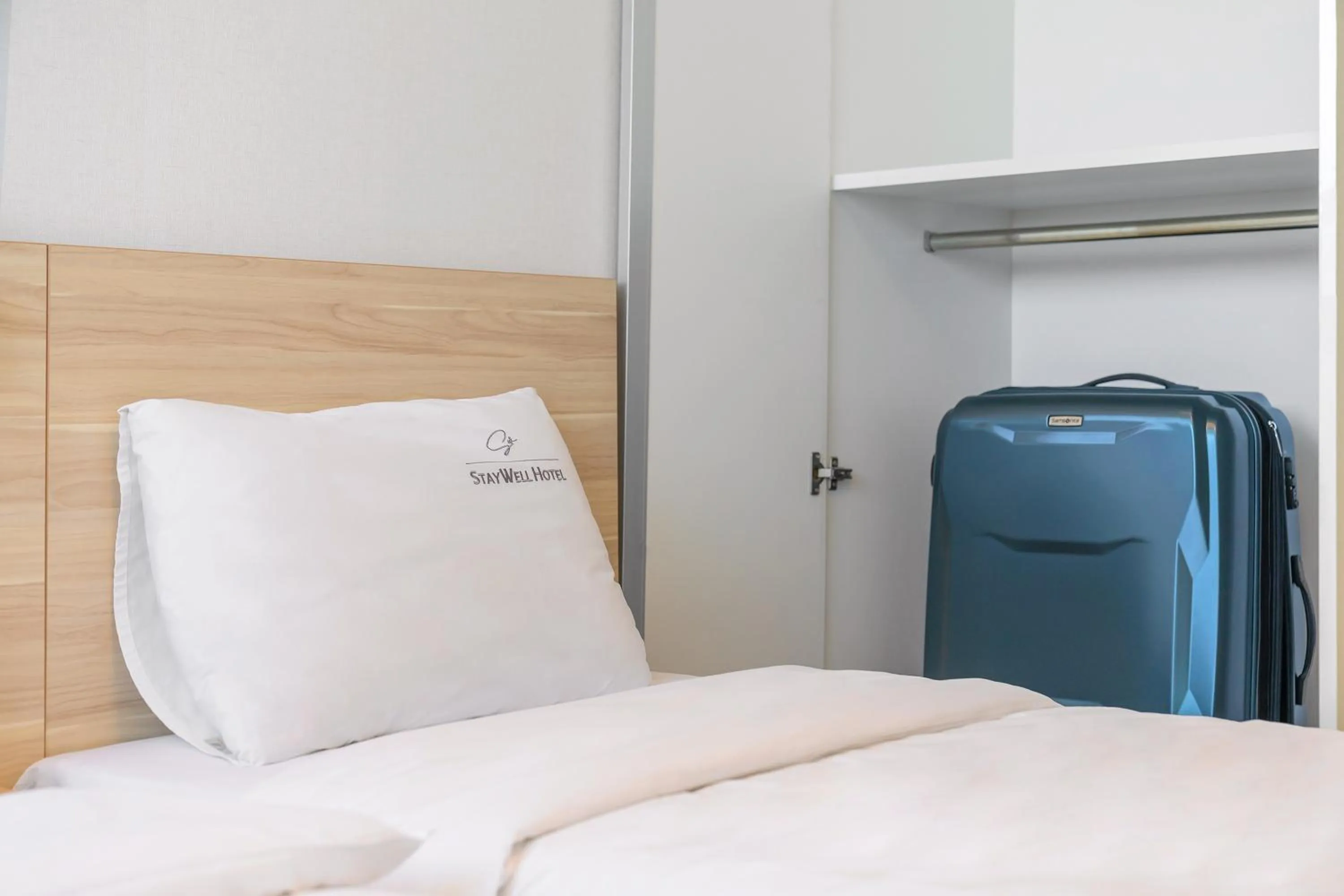 Bed in Staywell Hotel