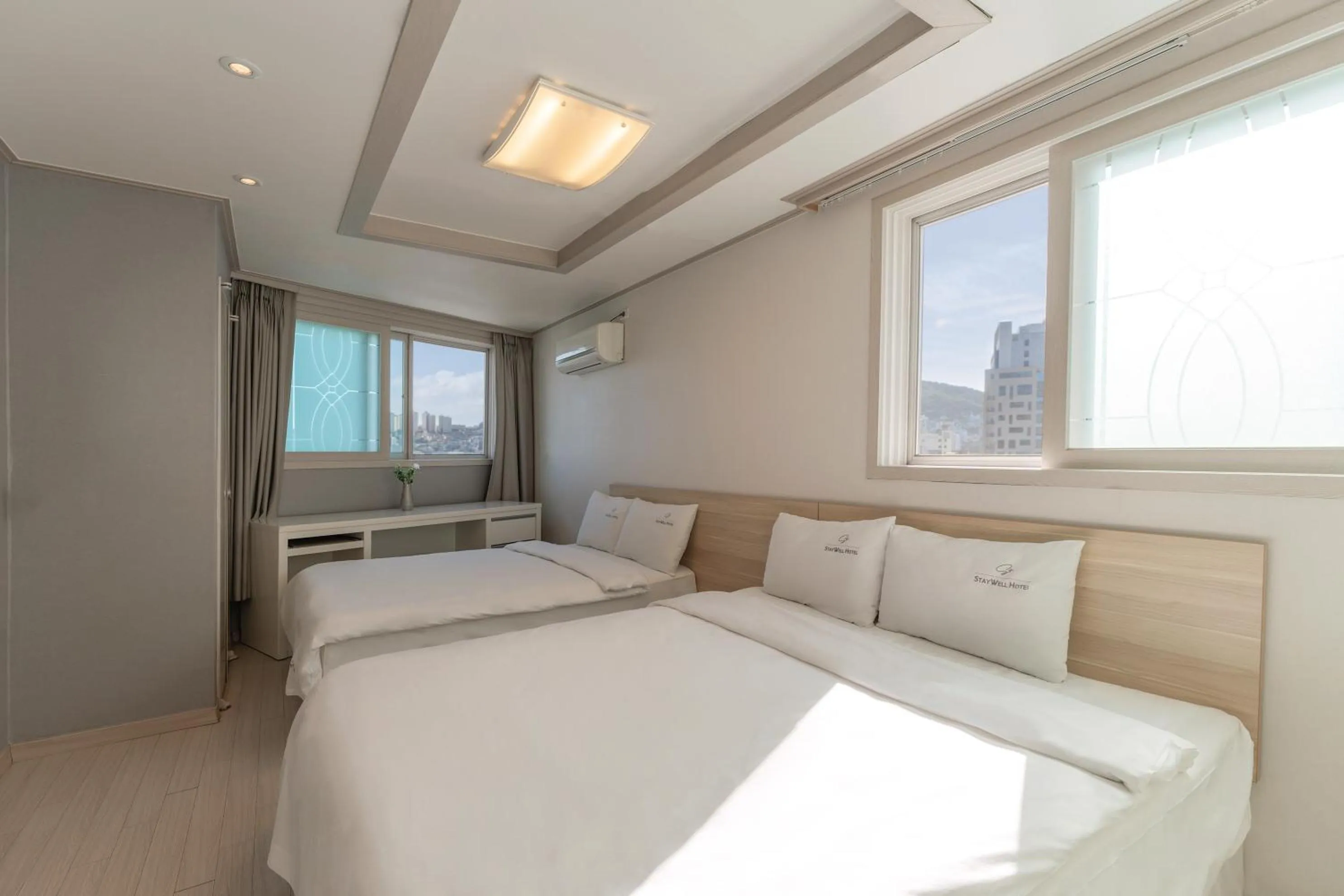 Bed in Staywell Hotel