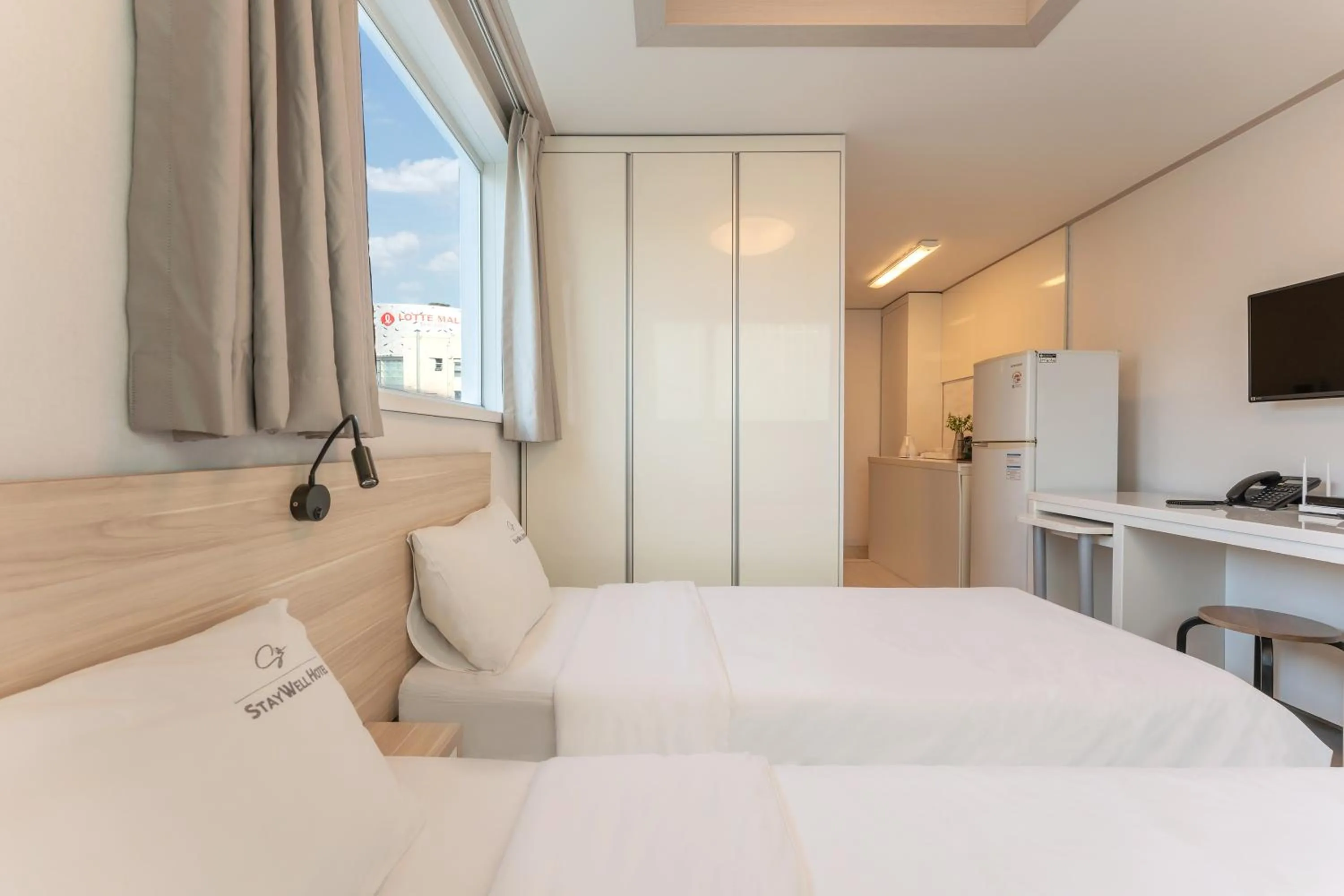 Bed in Staywell Hotel