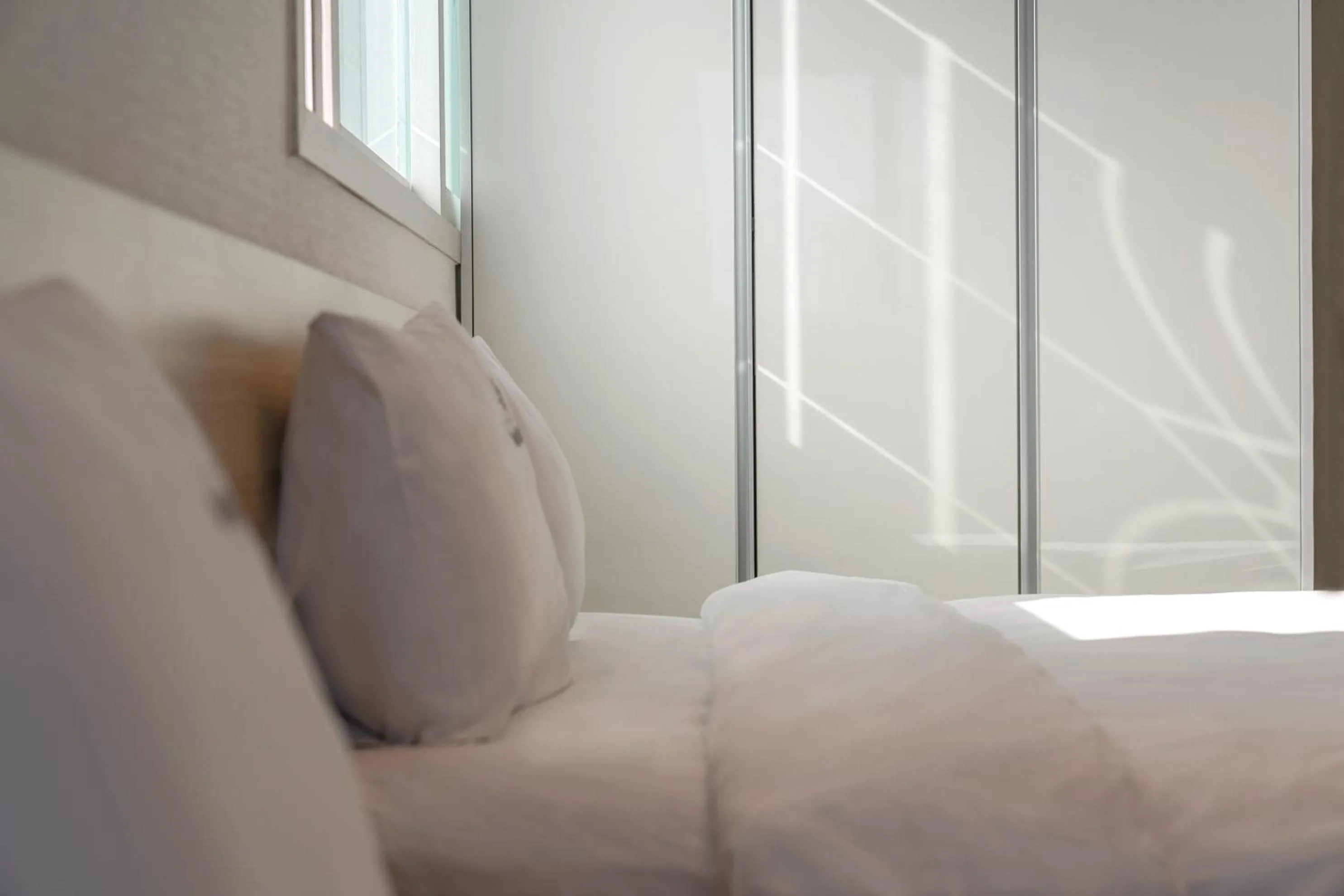 Bed in Staywell Hotel