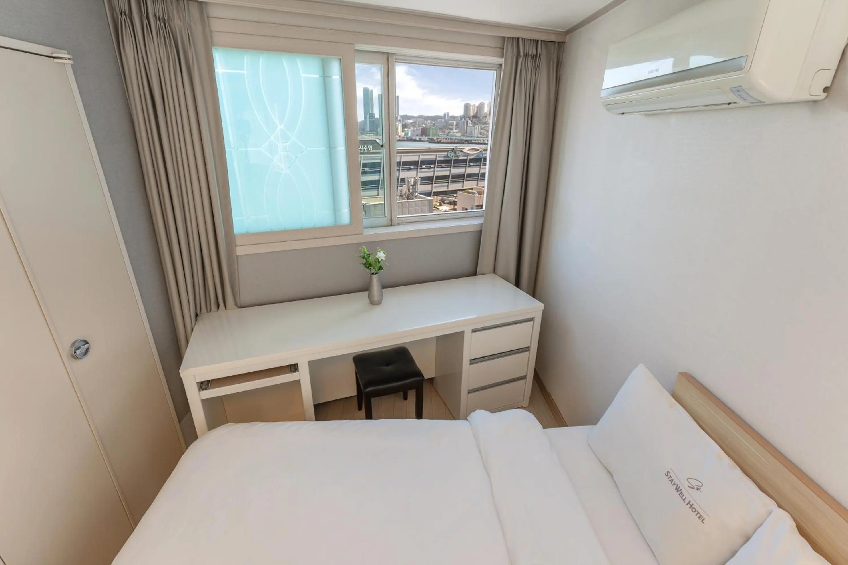 Bed in Staywell Hotel