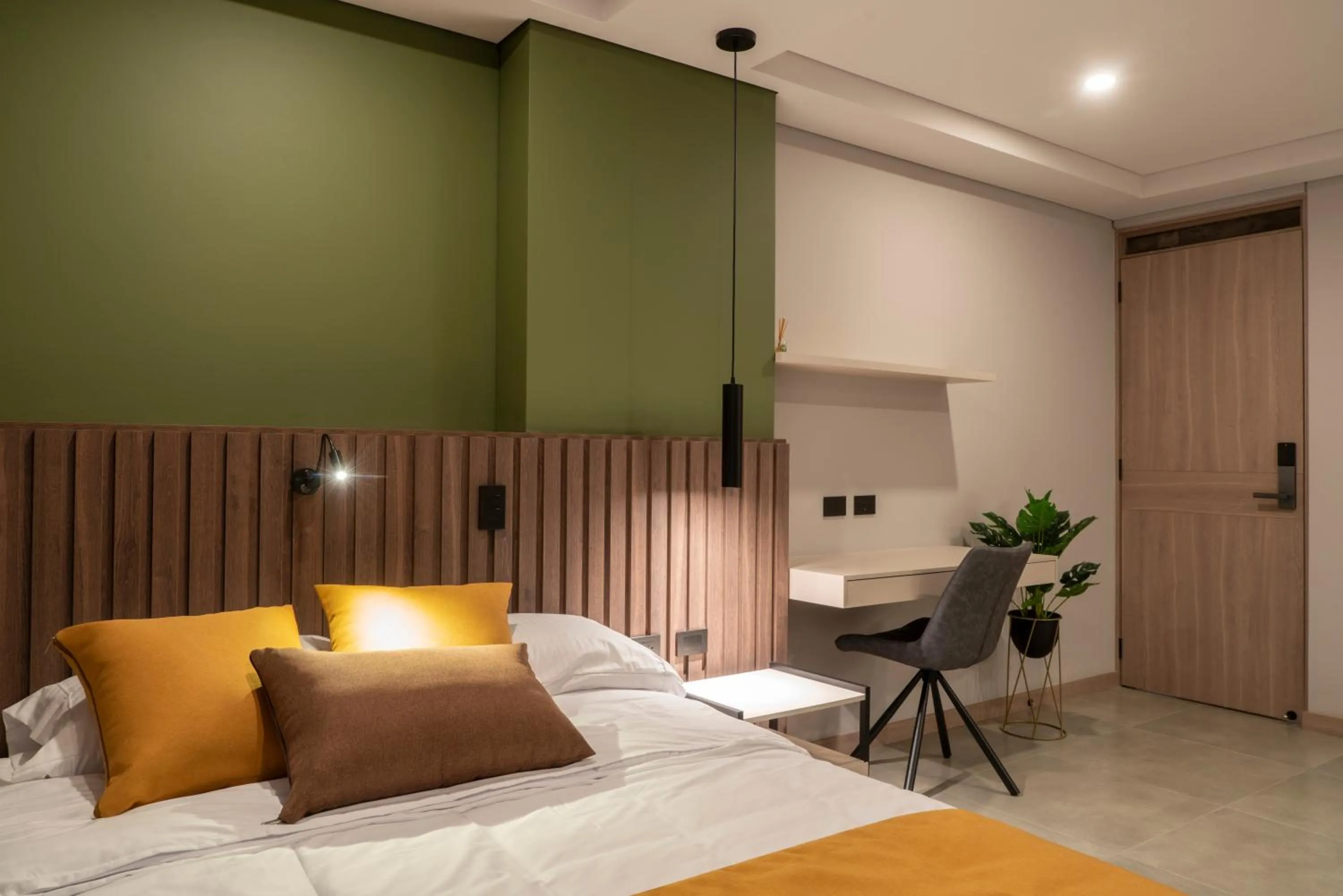 Bed in Hotel Living 35 Suites