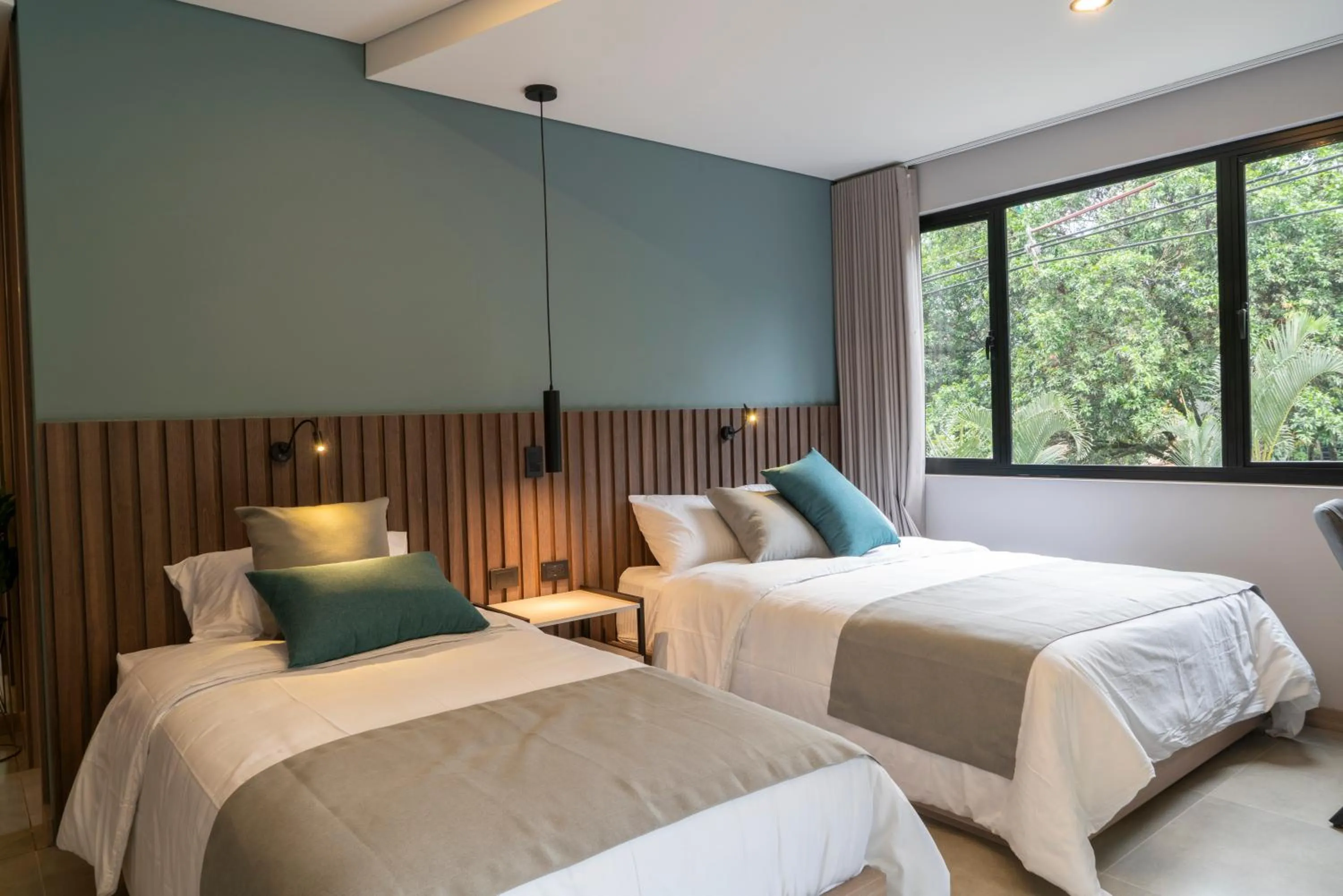 Bed in Hotel Living 35 Suites