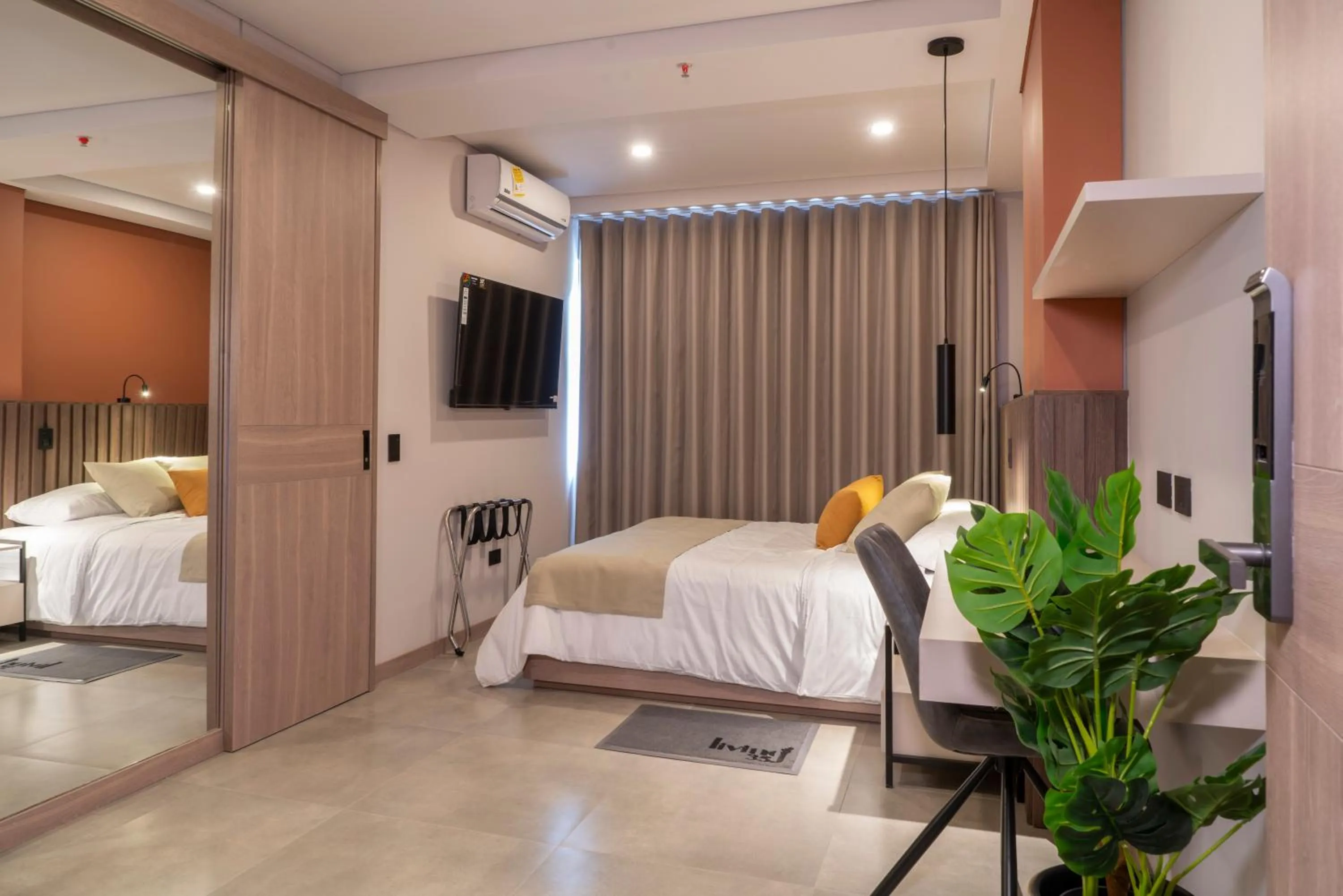 Bed in Hotel Living 35 Suites